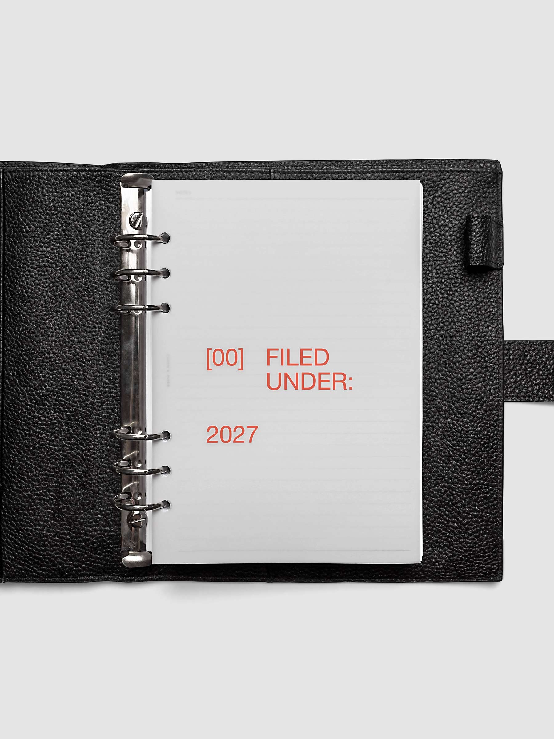 2027 Front + Monthly Dashboard Overlays, Saffron, A5 6-Ring Punch, vellum dashboard overlay shown layered inside a planner