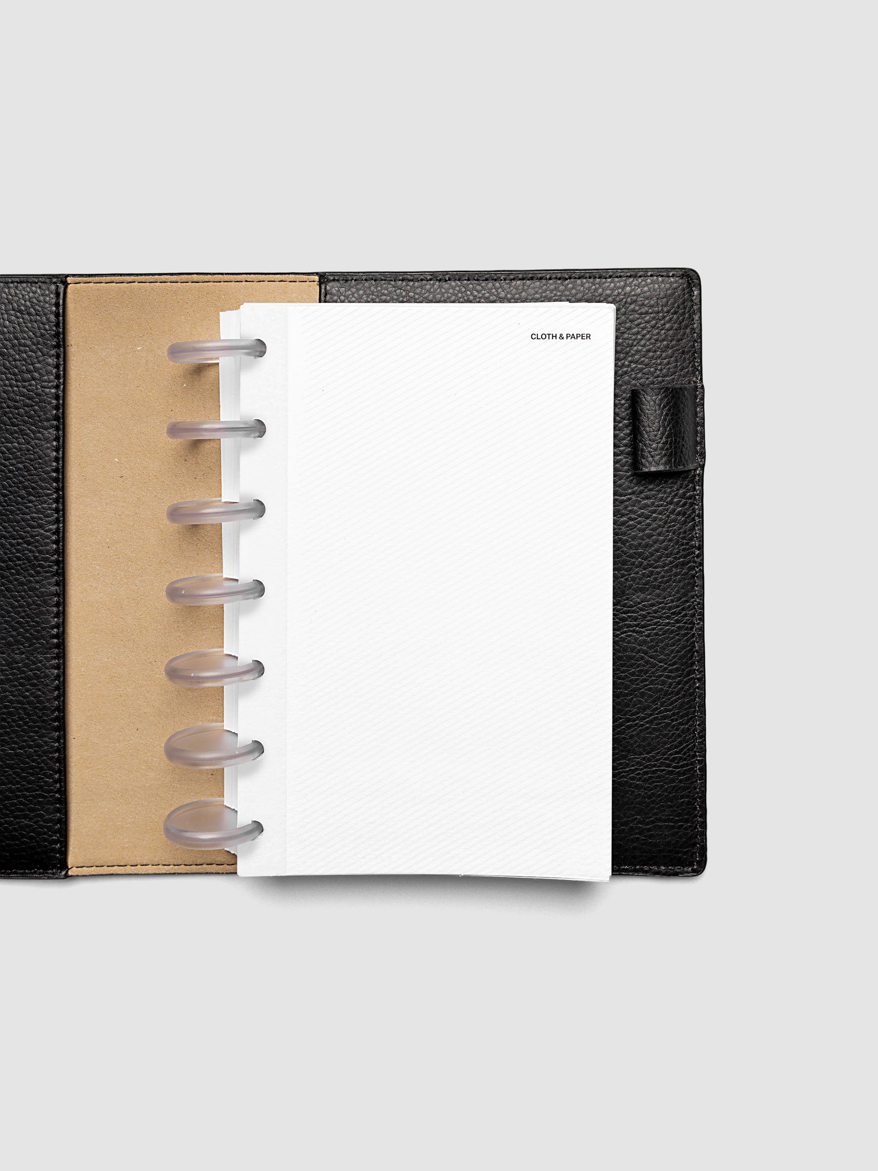 Folded Collage Planner Dashboard, HP Mini 7-Disc Punch, dashboard shown inserted in a planner