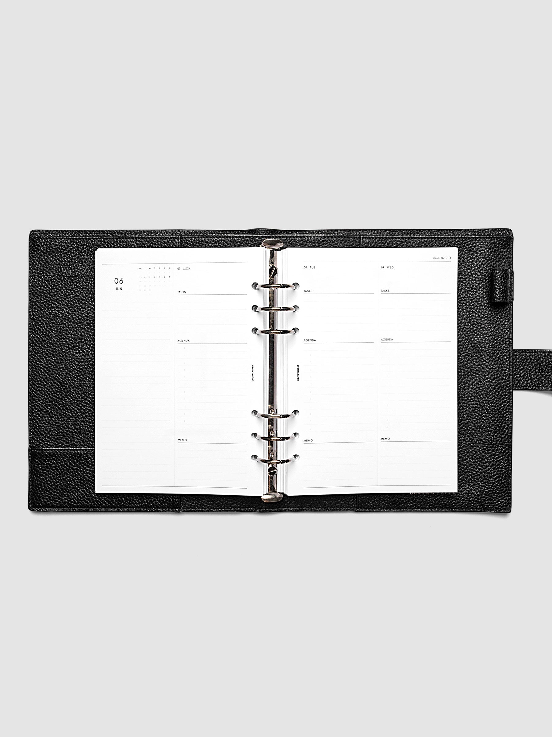 2027 Dated Daily Inserts | Monday Start in size A5 6-Ring Punch inside a black planner cover