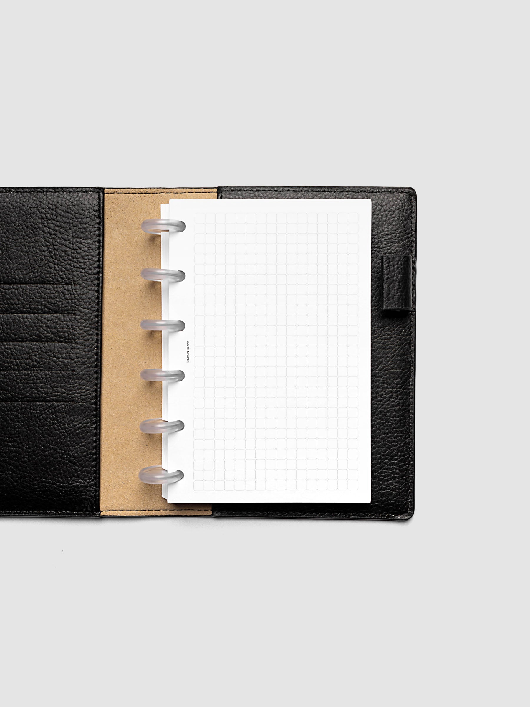 Rounded Graph Planner Insert CP Petite 6-Disc Punch open to an unused grid page