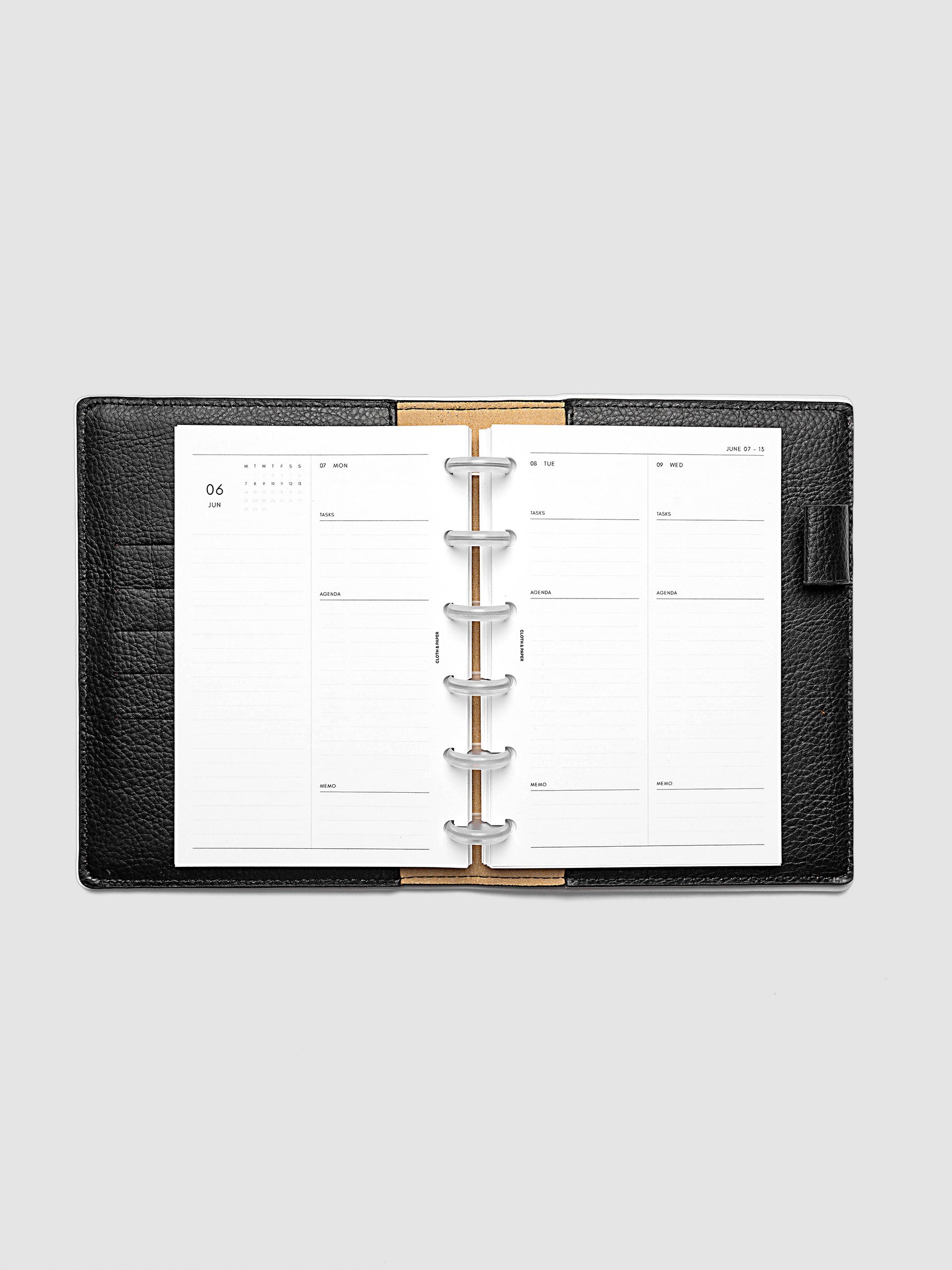 2027 Dated Daily Inserts | Monday Start in size CP Petite 6-Disc Punch inside a black planner cover