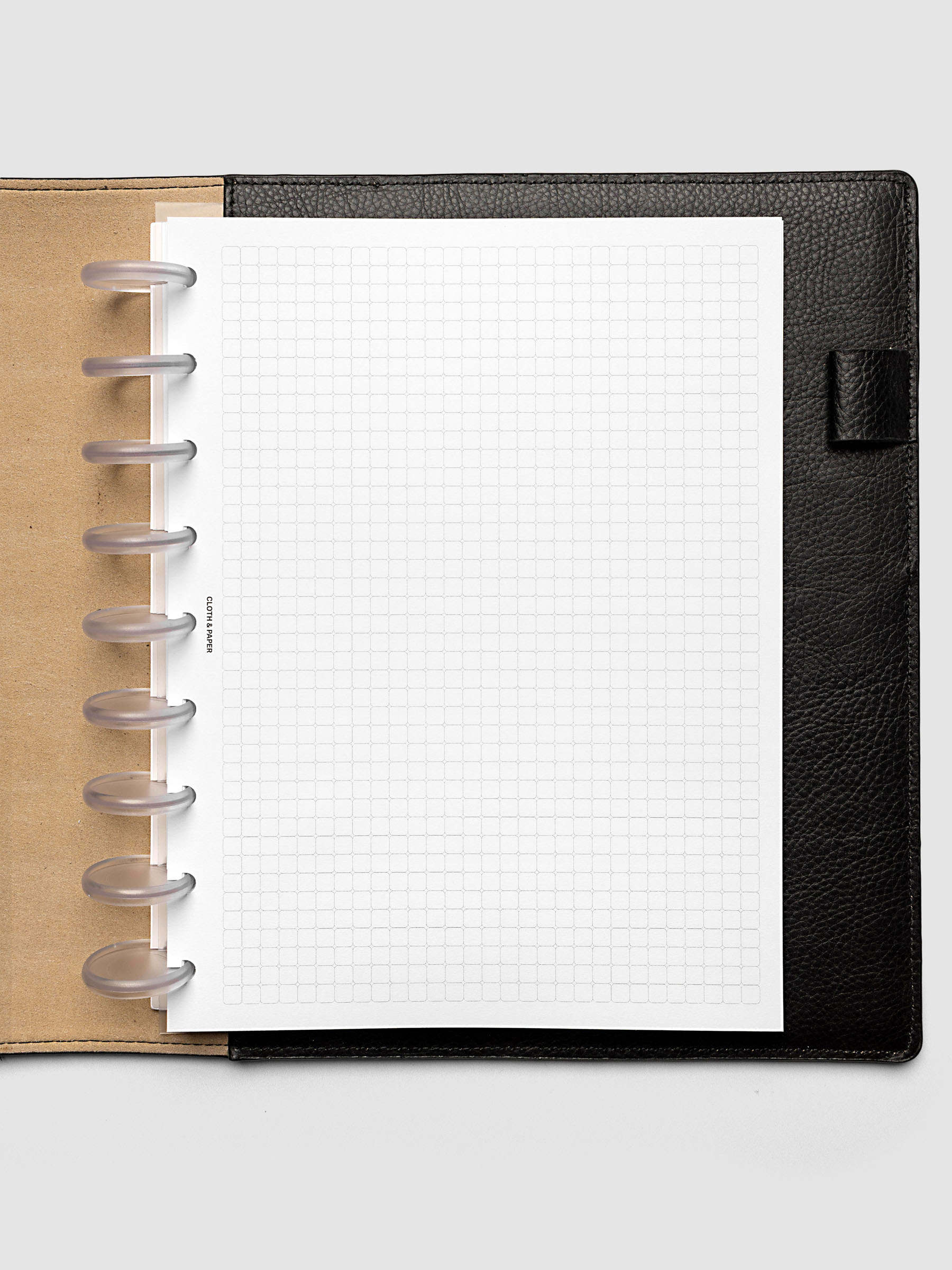 Rounded Graph Planner Insert HP Classic 9-Disc Punch open to an unused grid page