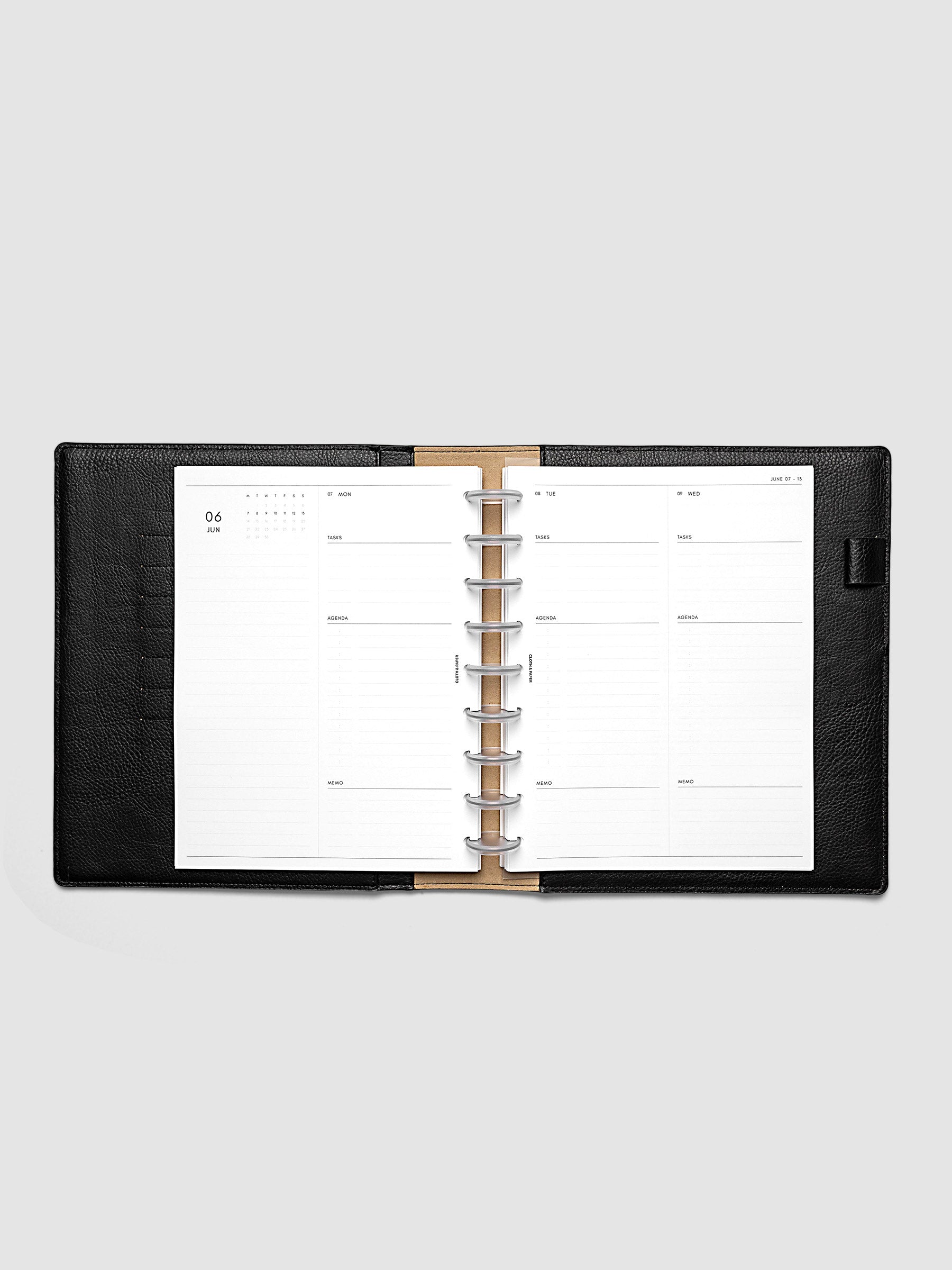 2027 Dated Daily Inserts | Monday Start in size HP Classic 9-Disc Punch inside a black planner cover