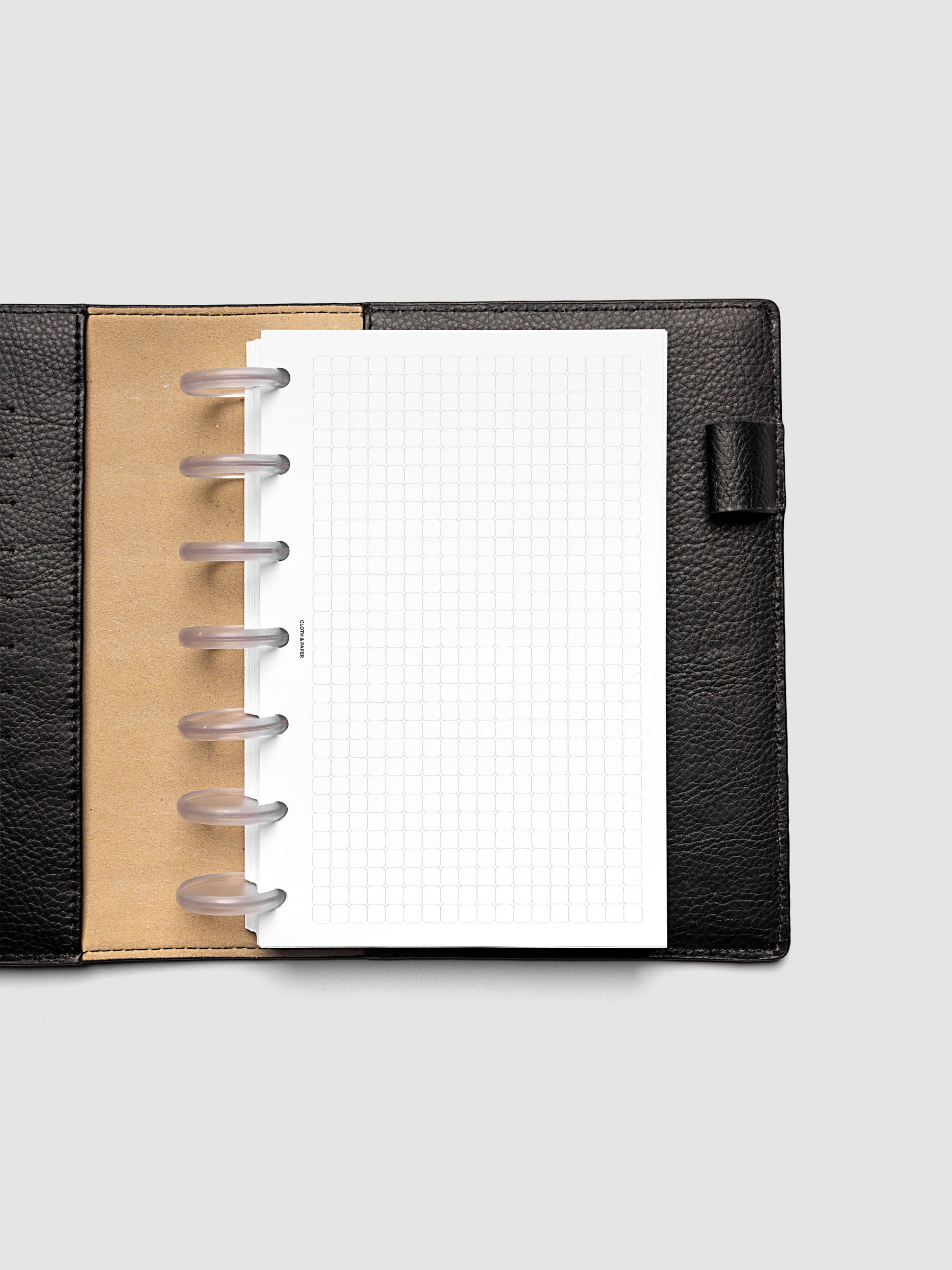 Rounded Graph Planner Insert HP Mini 7-Disc Punch open to an unused grid page
