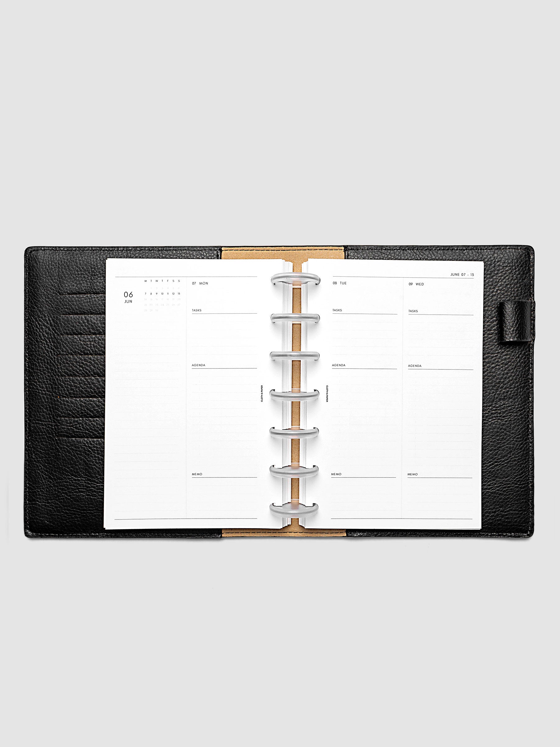 2027 Dated Daily Inserts | Monday Start in size HP Mini 7-Disc Punch inside a black planner cover