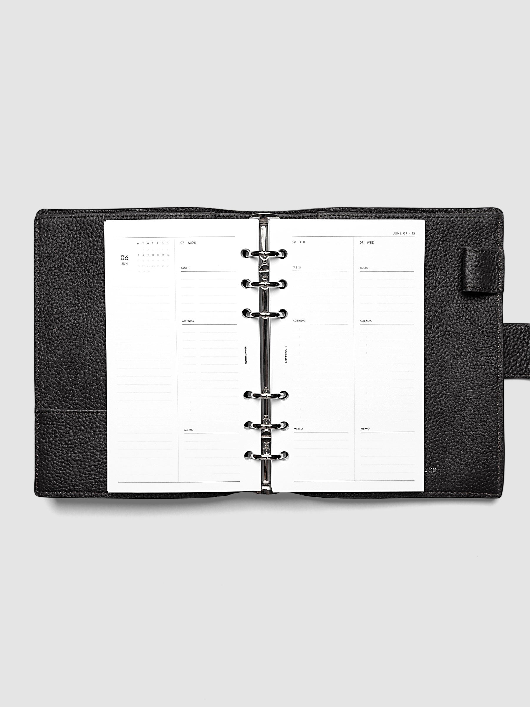 2027 Dated Daily Inserts | Monday Start in size Personal 6-Ring Punch inside a black planner cover