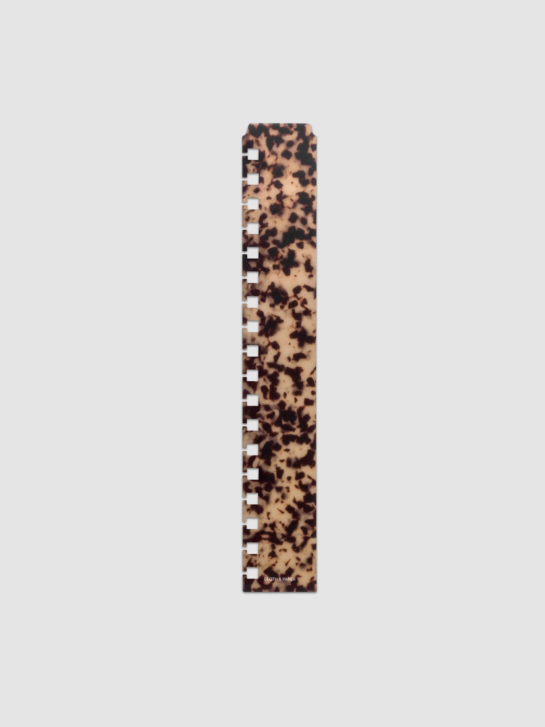 One narrow page marker in tortoiseshell pattern, shown in size HP Classic Spiral.