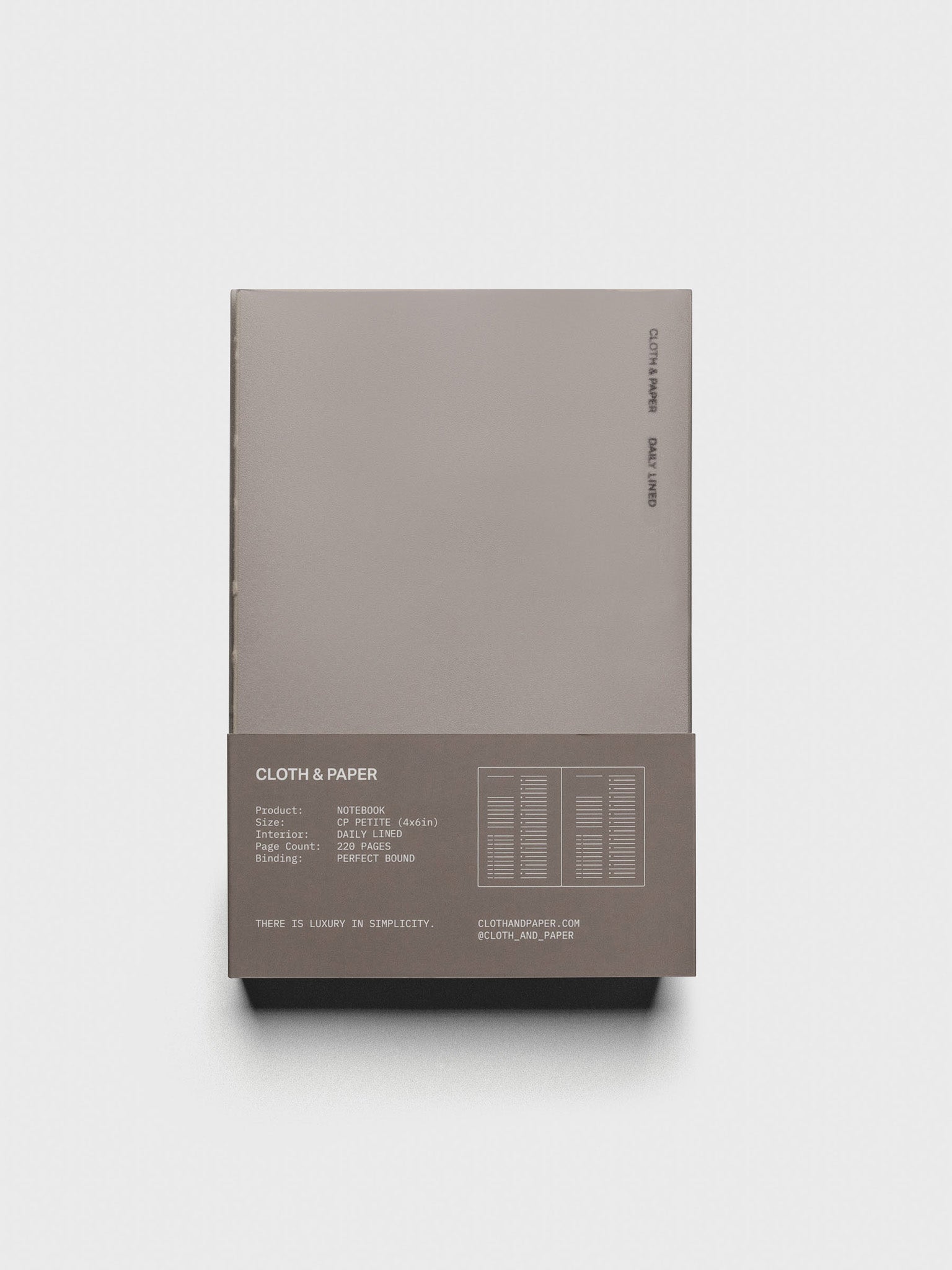 Perfect Bound Notebook | CP Petite | Daily Lined | Verona shown closed, laying flat in packaging, on a neutral background.
