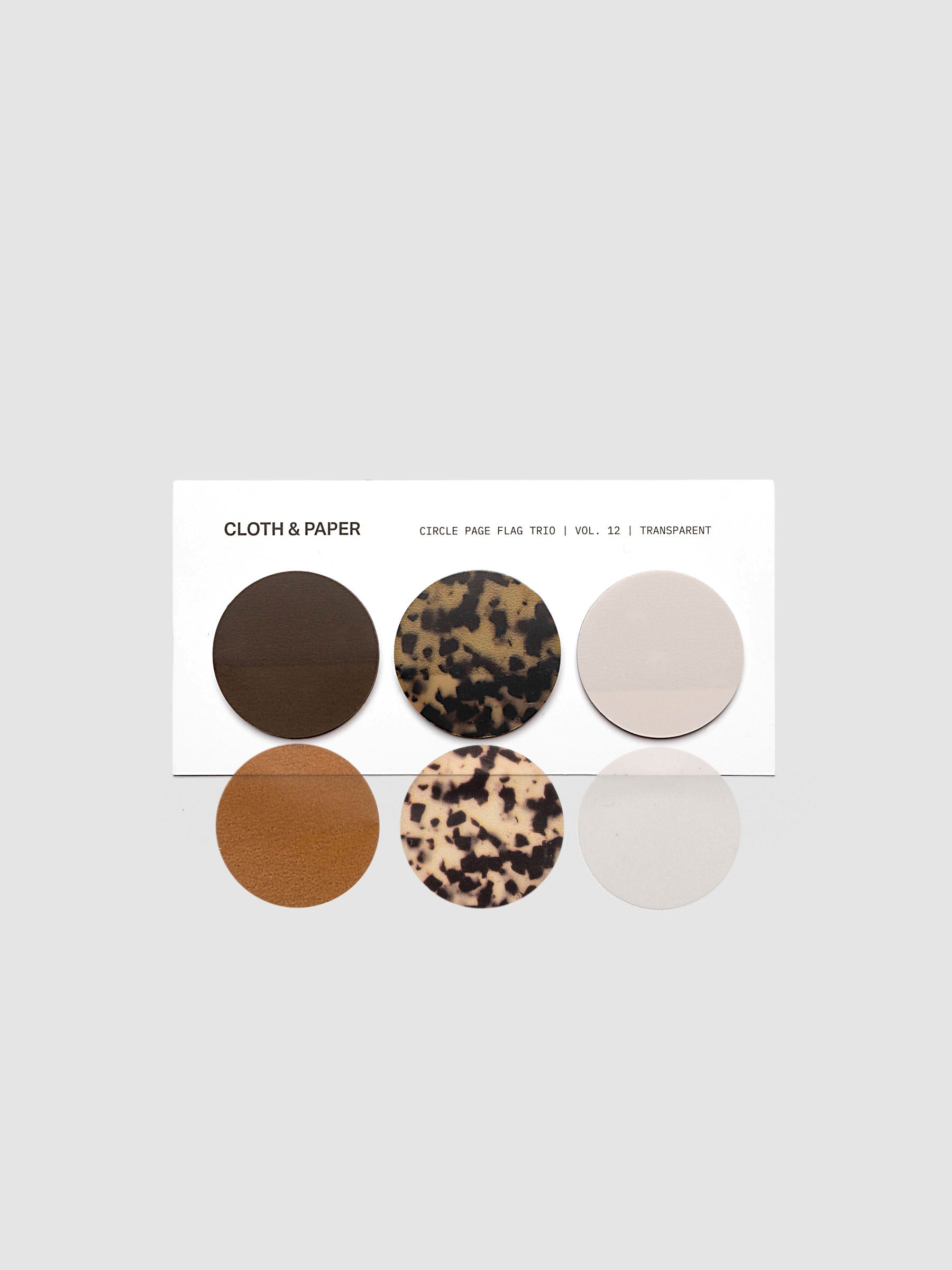 Circle Page Flag Trio | Walnut, Desert Tortoiseshell, Ibiza on a backing card with one of each page flag shown below to demonstrate transparency.