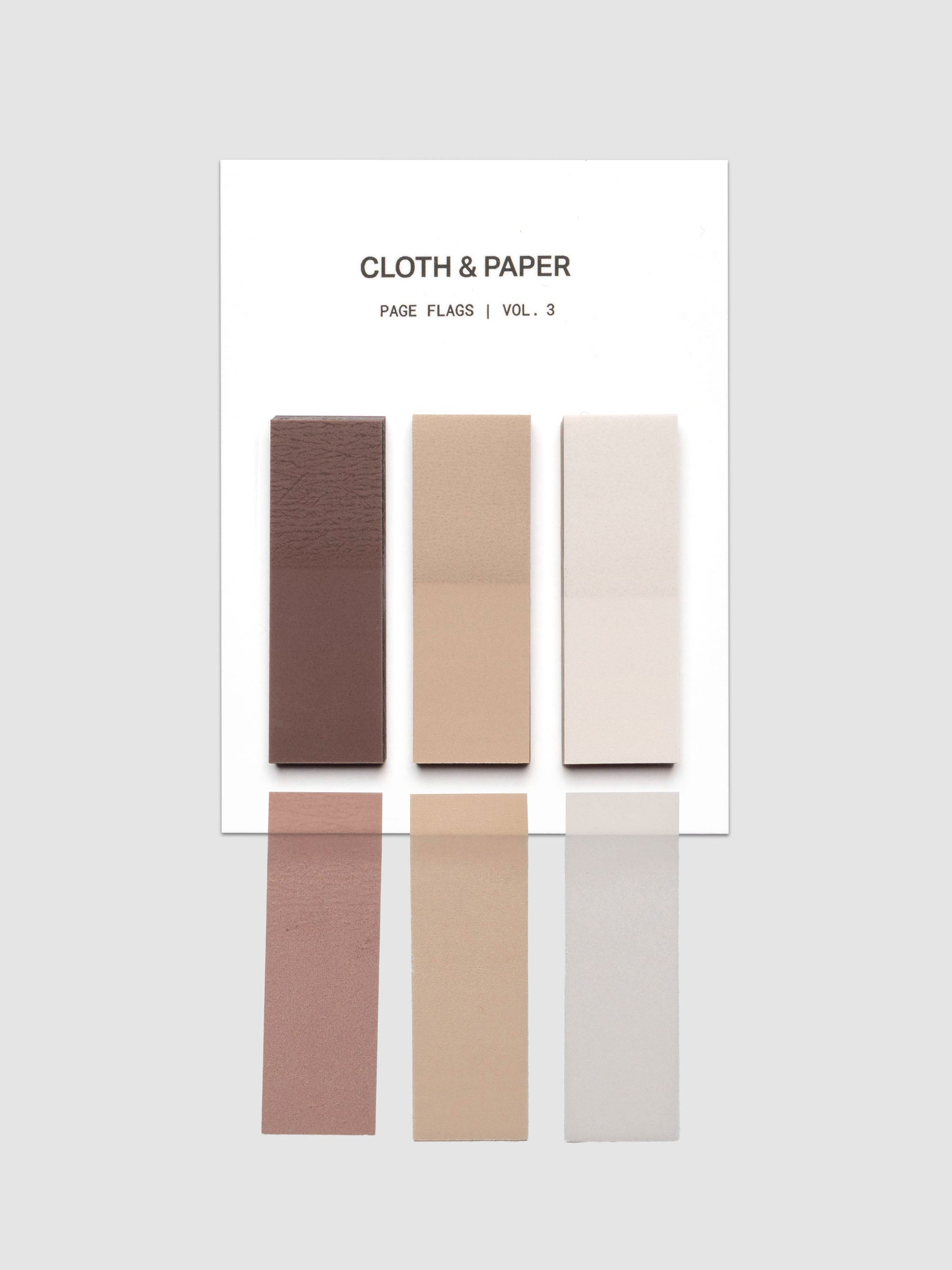 One set of a Rectangular Page Flag Trio shown in the colors Beignet | Moscow | Bourbon with one of each shown below