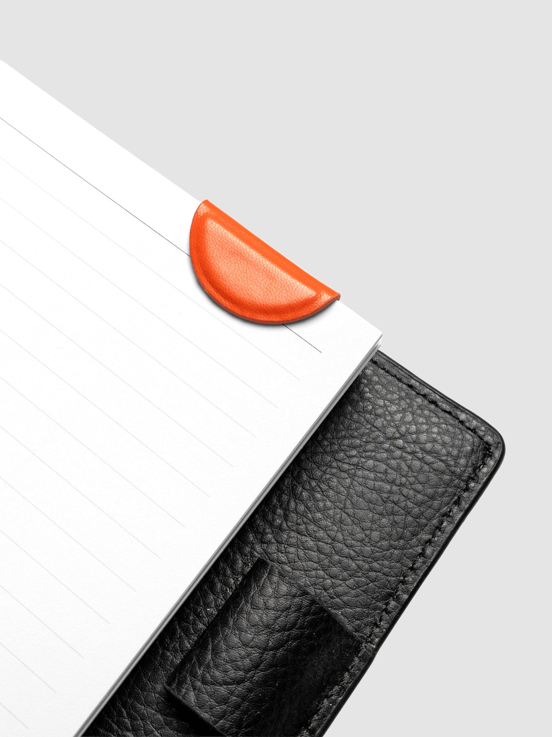 Saffron (orange) mini magnetic bookmark folded over planner pages