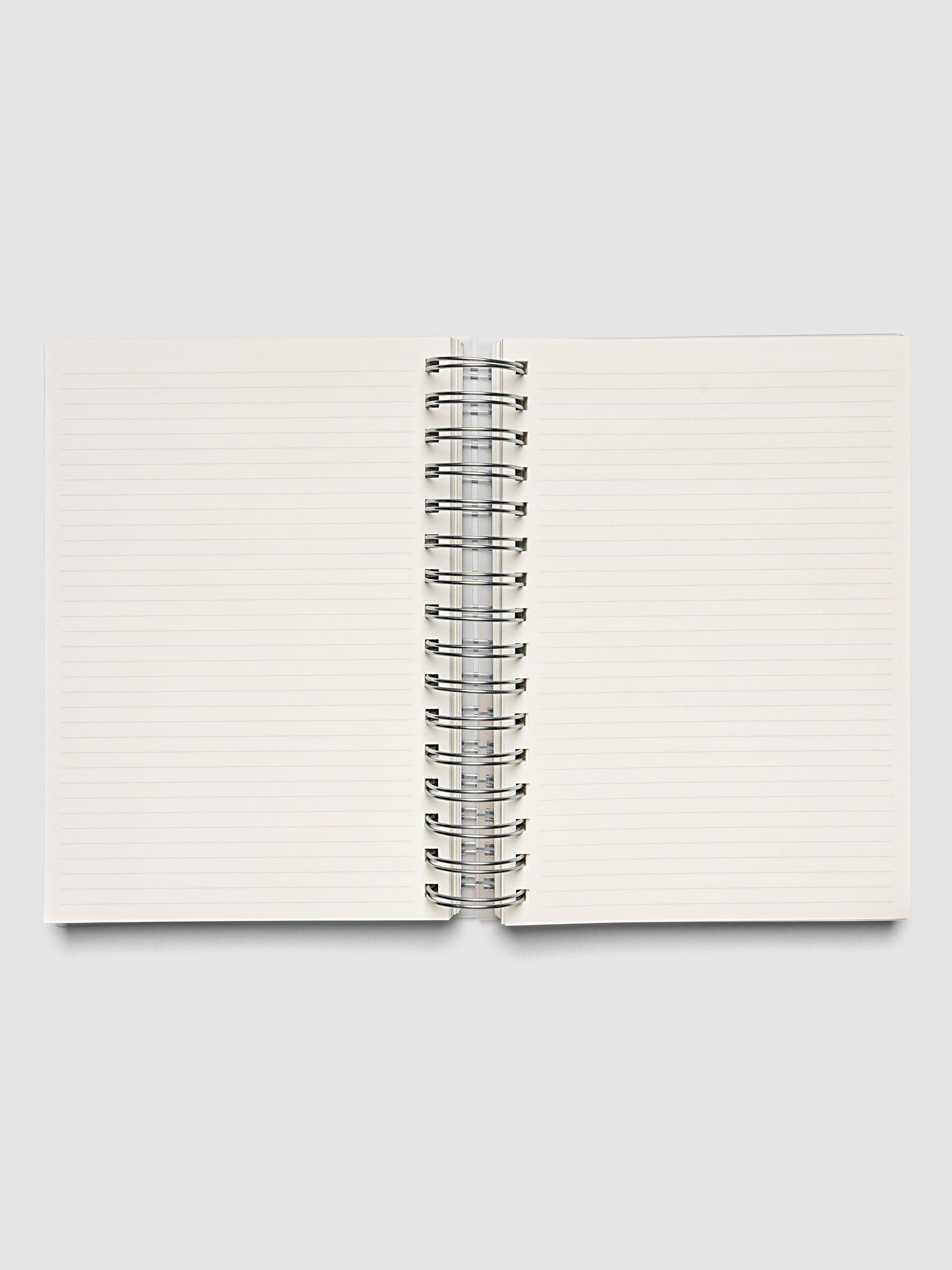5 Subject Notebook A5 Punch open interior showing cream lined pages and spiral binding