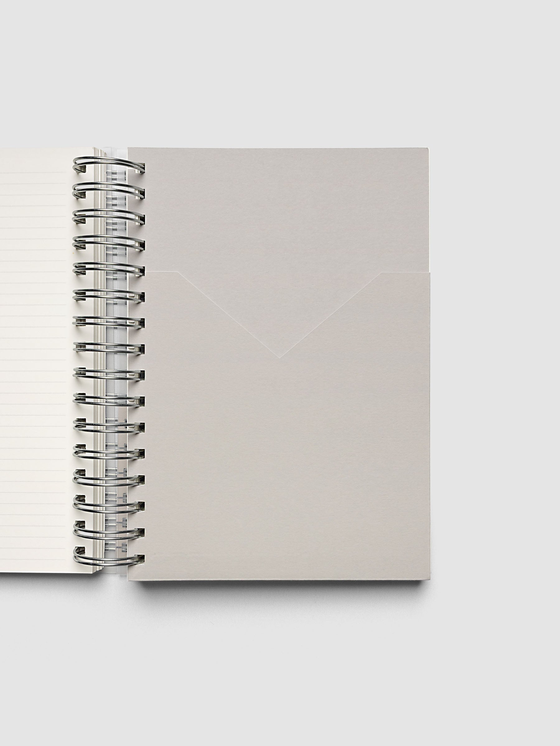 5 Subject Notebook A5 Punch open interior showing concrete grey pocket divider