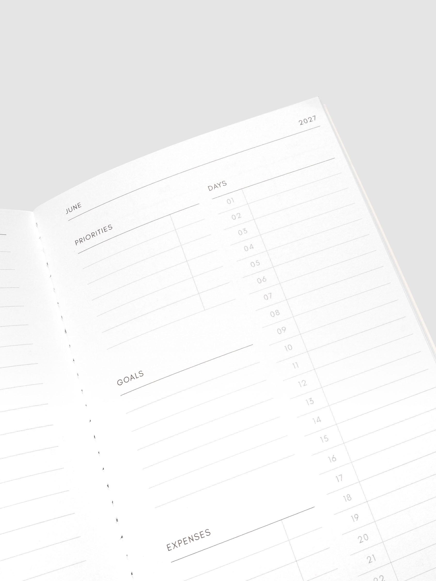 Close-up of the top of the right page of the 2027 Dated Travel Notebook Monthly in A5 Slim size, showing the days, priorities, goals, and expenses sections