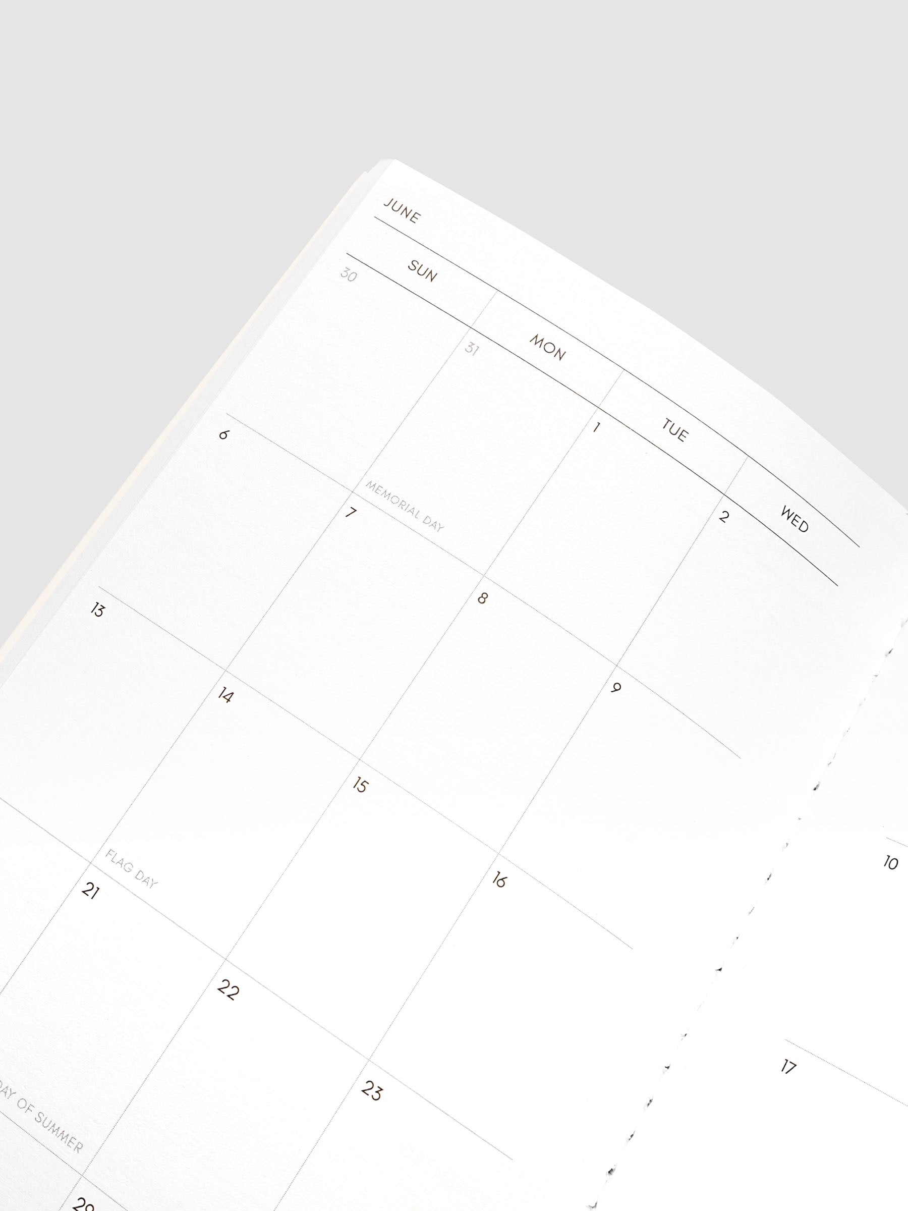 Close-up of the top of the left page of the 2027 Dated Travel Notebook Monthly in A5 Slim size, showing the dated calendar grid