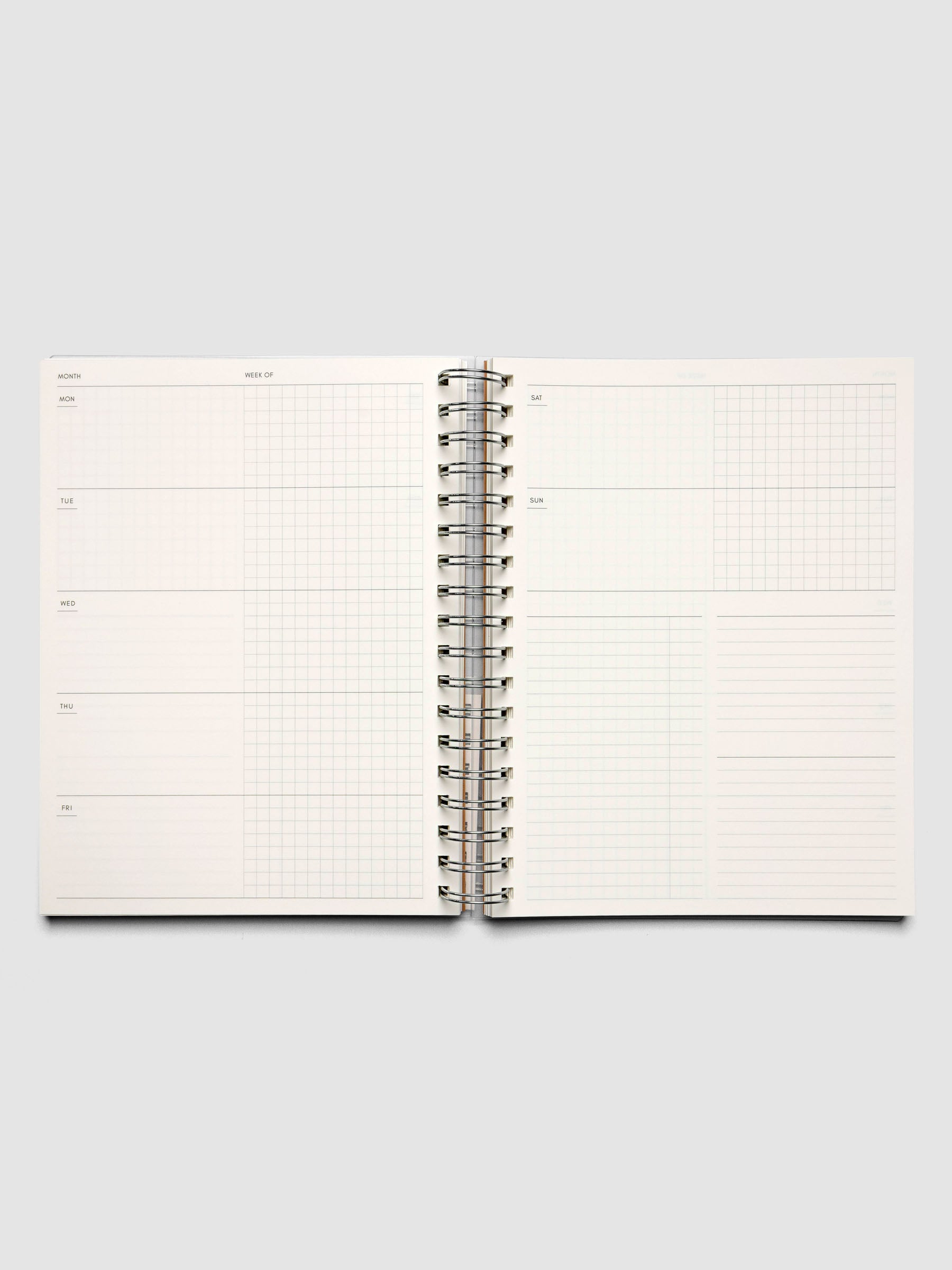 Spiral Notebook in size HP Classic and color Moscow (orange) shown open displaying Weekly Horizontal interior layout.