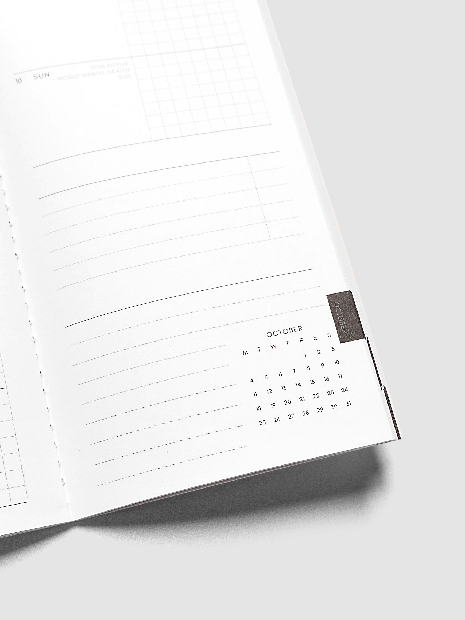 Close-up of the bottom of the right page of the Jul–Dec 2027 Dated Travel Notebook, showing the lined notes section and month-at-a-glance view