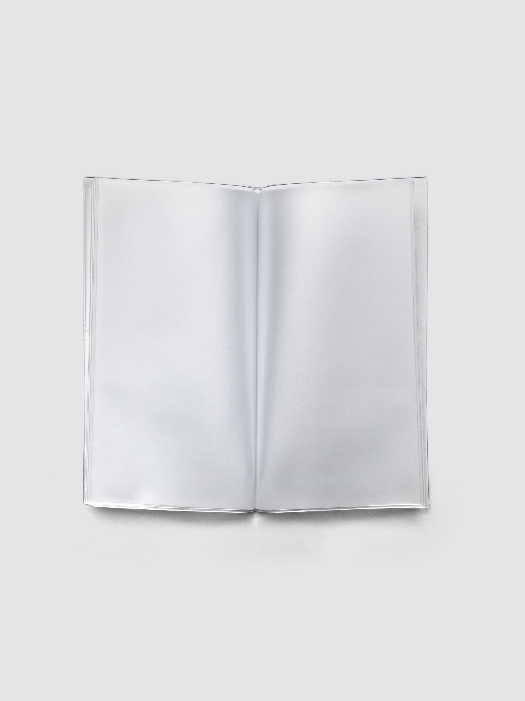 Pocket Plus sized clear organizer with sticker sheets placed in a pocket.