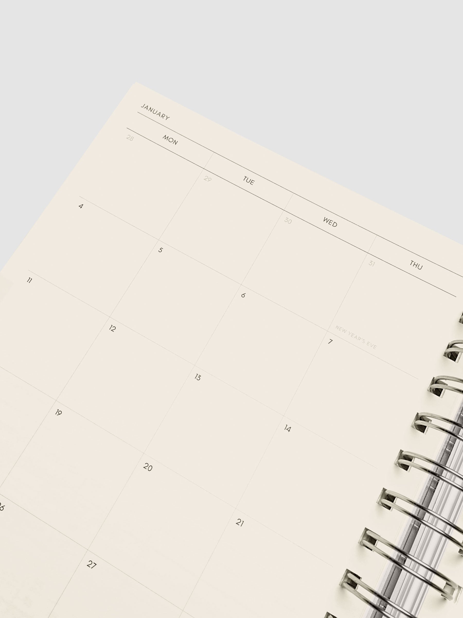Close-up of the left page of the two-page monthly calendar spread showing the calendar grid with holidays marked, from the 2026–2027 Weekly Horizontal Academic Planner A5 Spiral