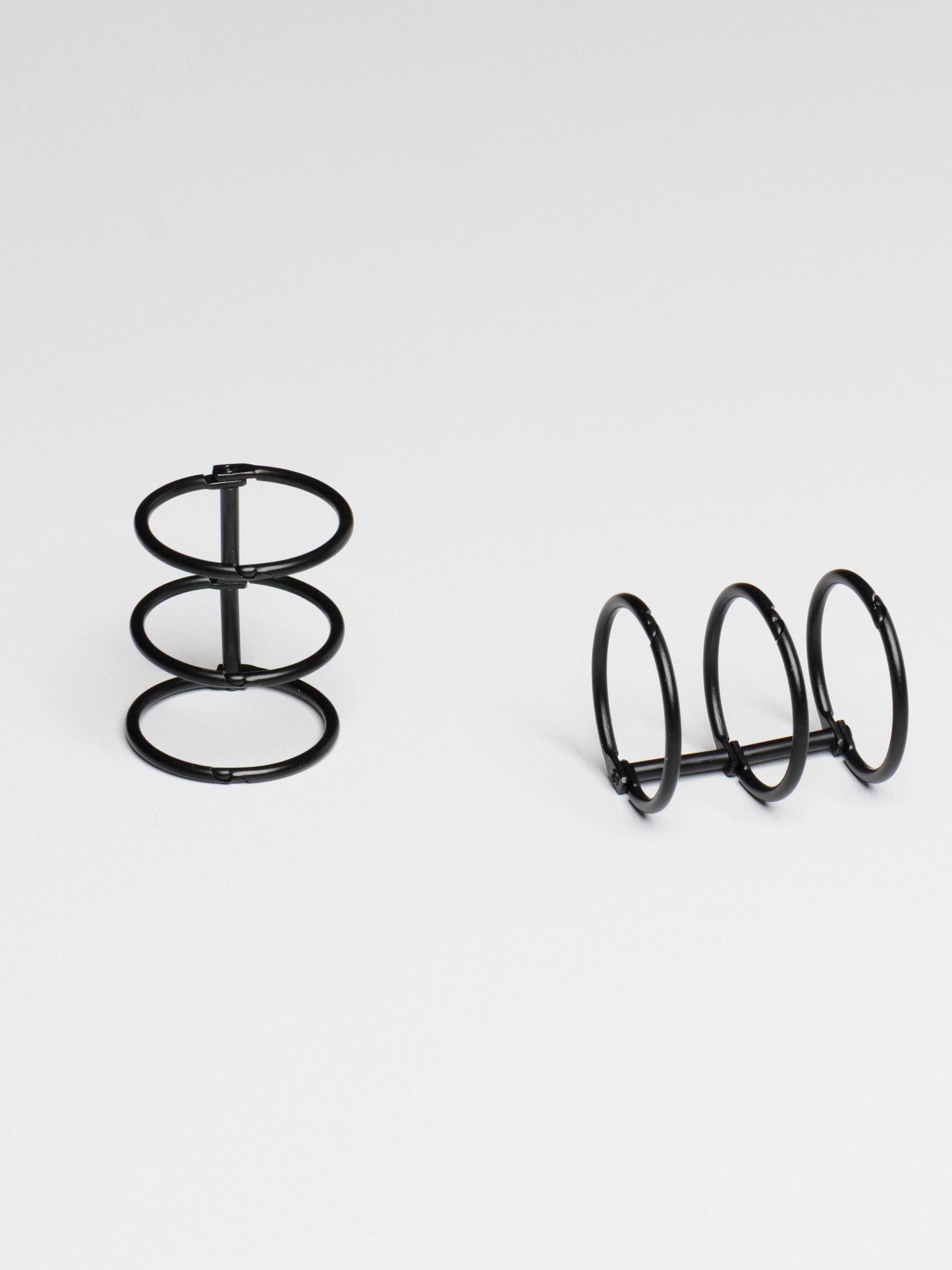 Planner rings displayed on a neutral background. Color shown is black.