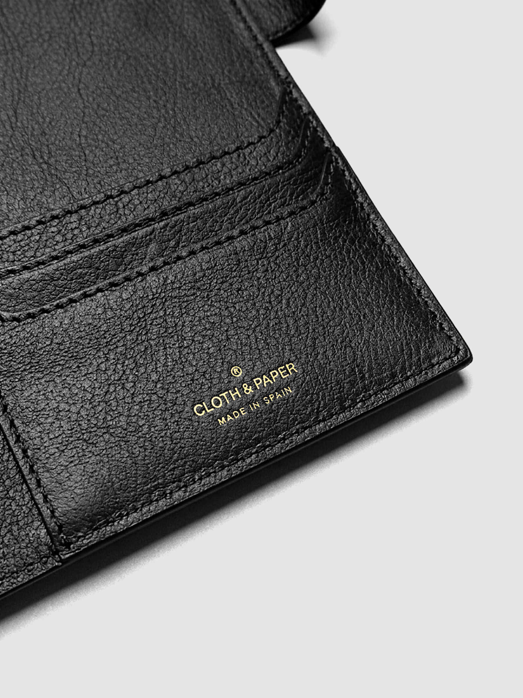 Detail of three credit card slots on the right interior of a black genuine leather A5 planner cover