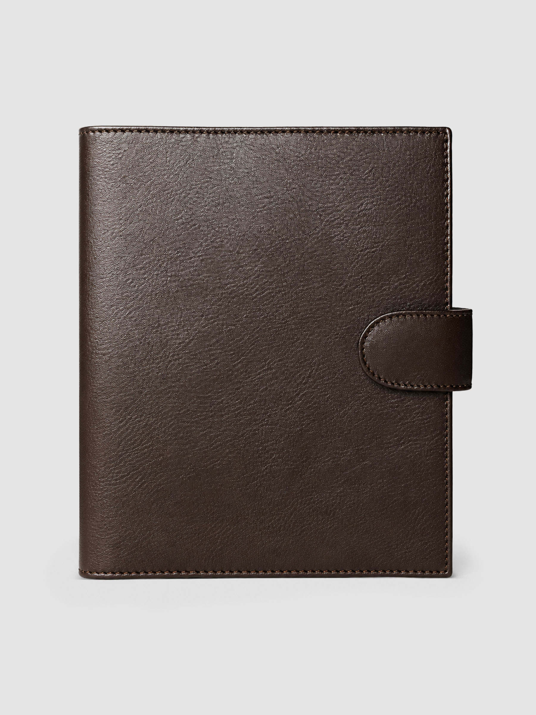 Dark brown genuine leather A5 6-ring planner cover with gold magnetic snap closure, closed front view