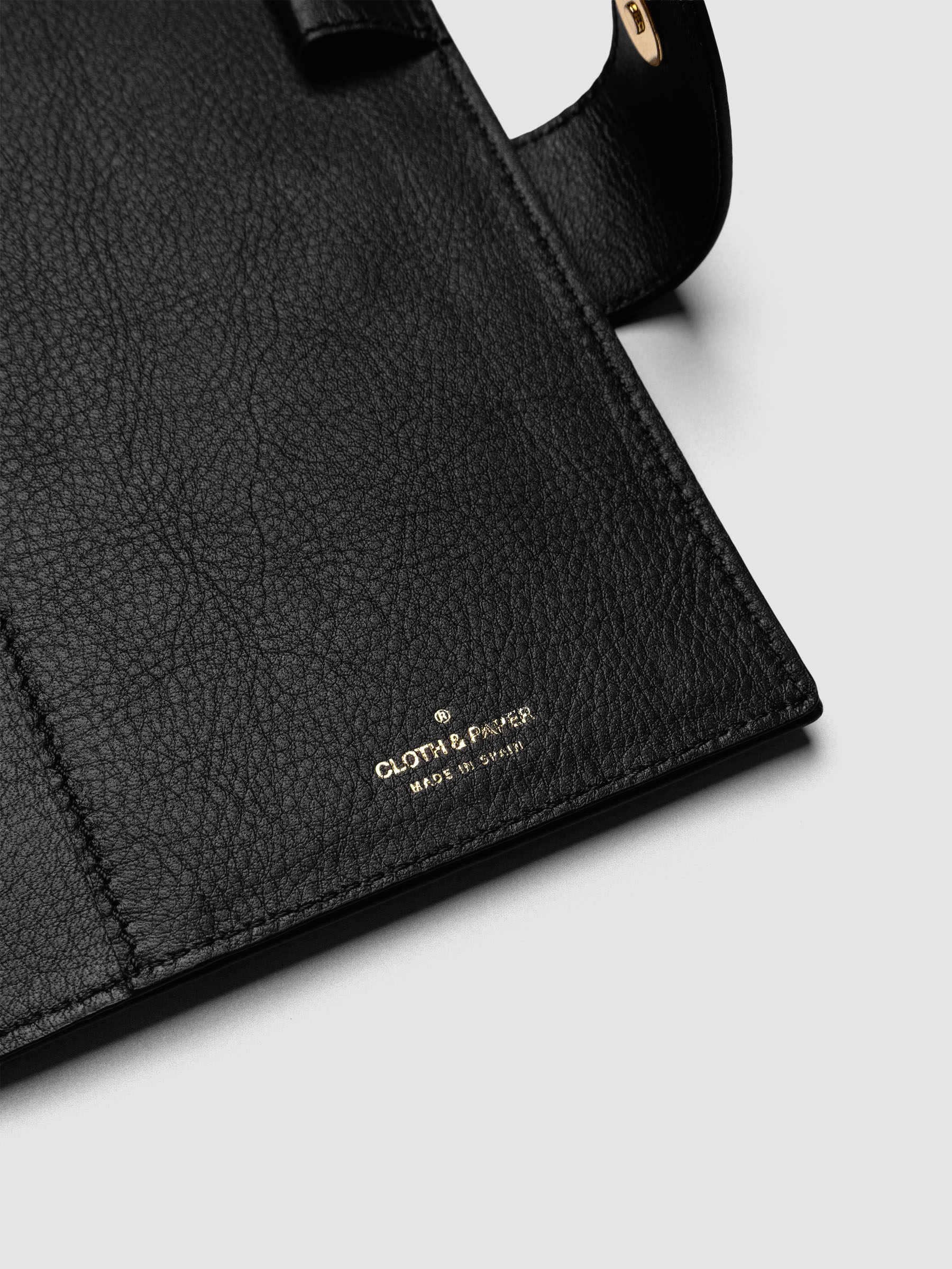Detail of three credit card slots on the interior of a black genuine leather Personal Wide 6-ring planner cover