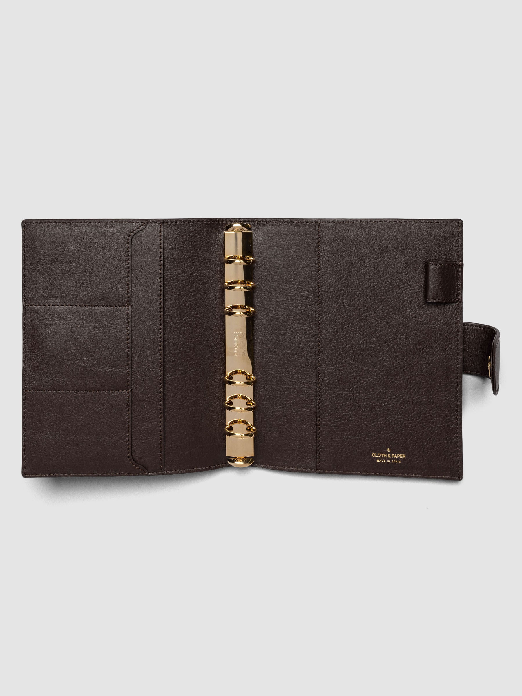 Open dark brown genuine leather Personal Wide 6-ring planner cover showing full interior, gold Krause rings and pockets visible on both sides