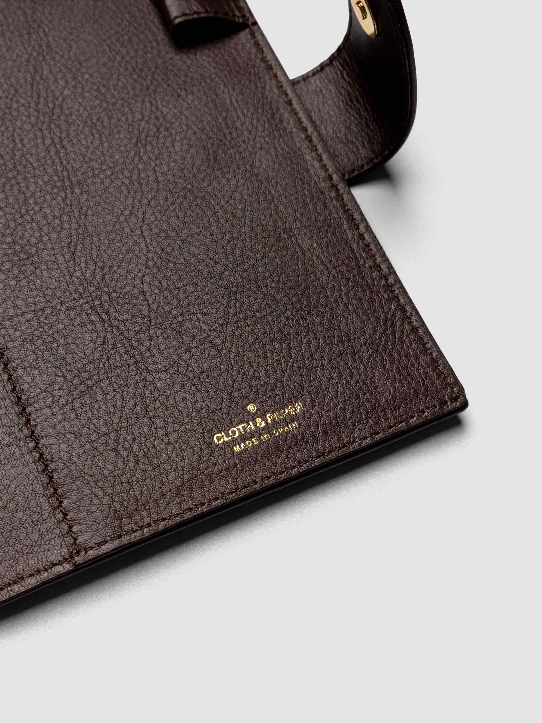 Detail of three credit card slots on the interior of a dark brown genuine leather Personal Wide 6-ring planner cover
