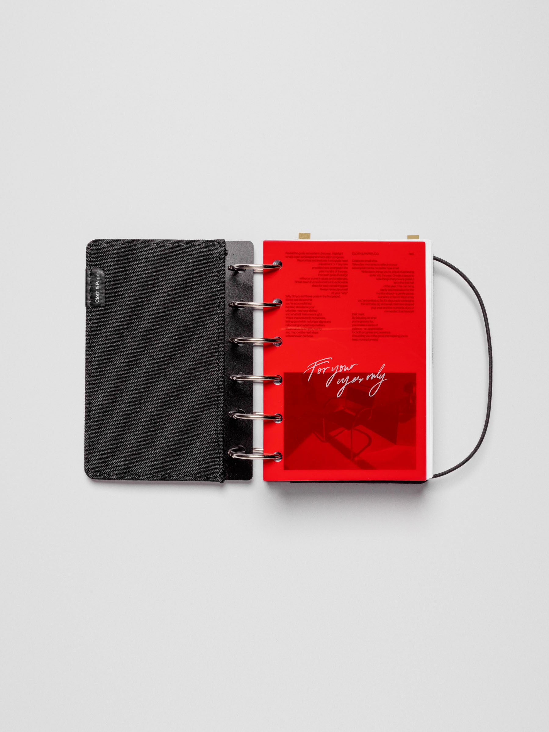 Dashboard duo displayed with a bookcloth planner cover on a neutral background. Size shown is Pocket.