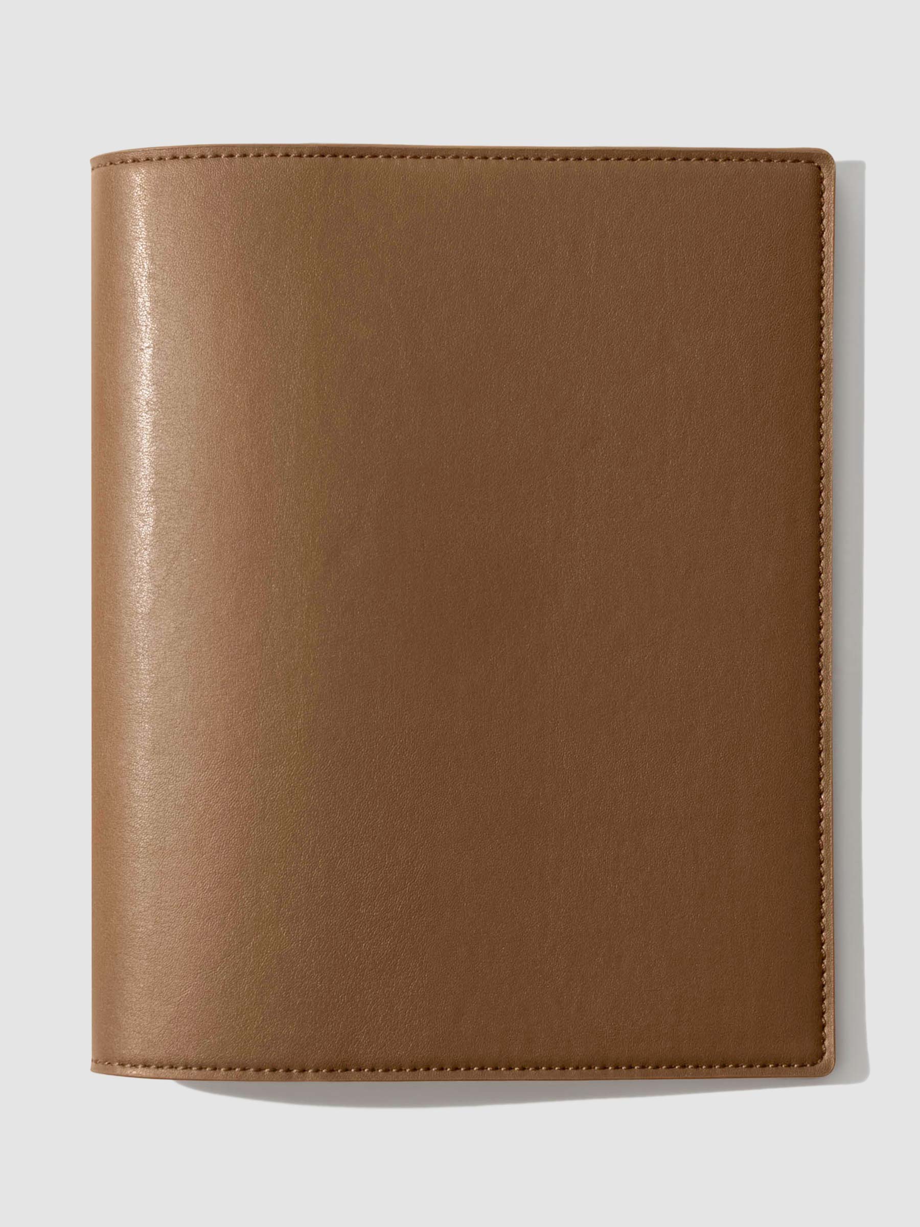 Folio displayed on a neutral background. Color shown is clay brown.