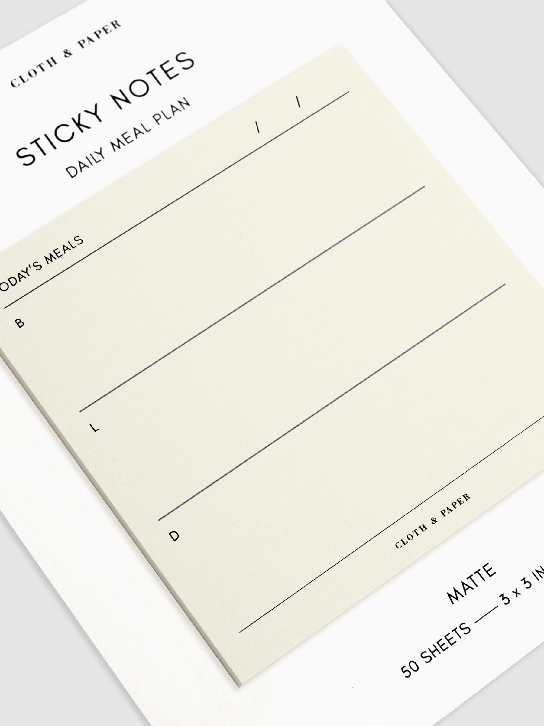 Close-up of a Daily Meal Plan Sticky Notes on their backing, against a neutral background.