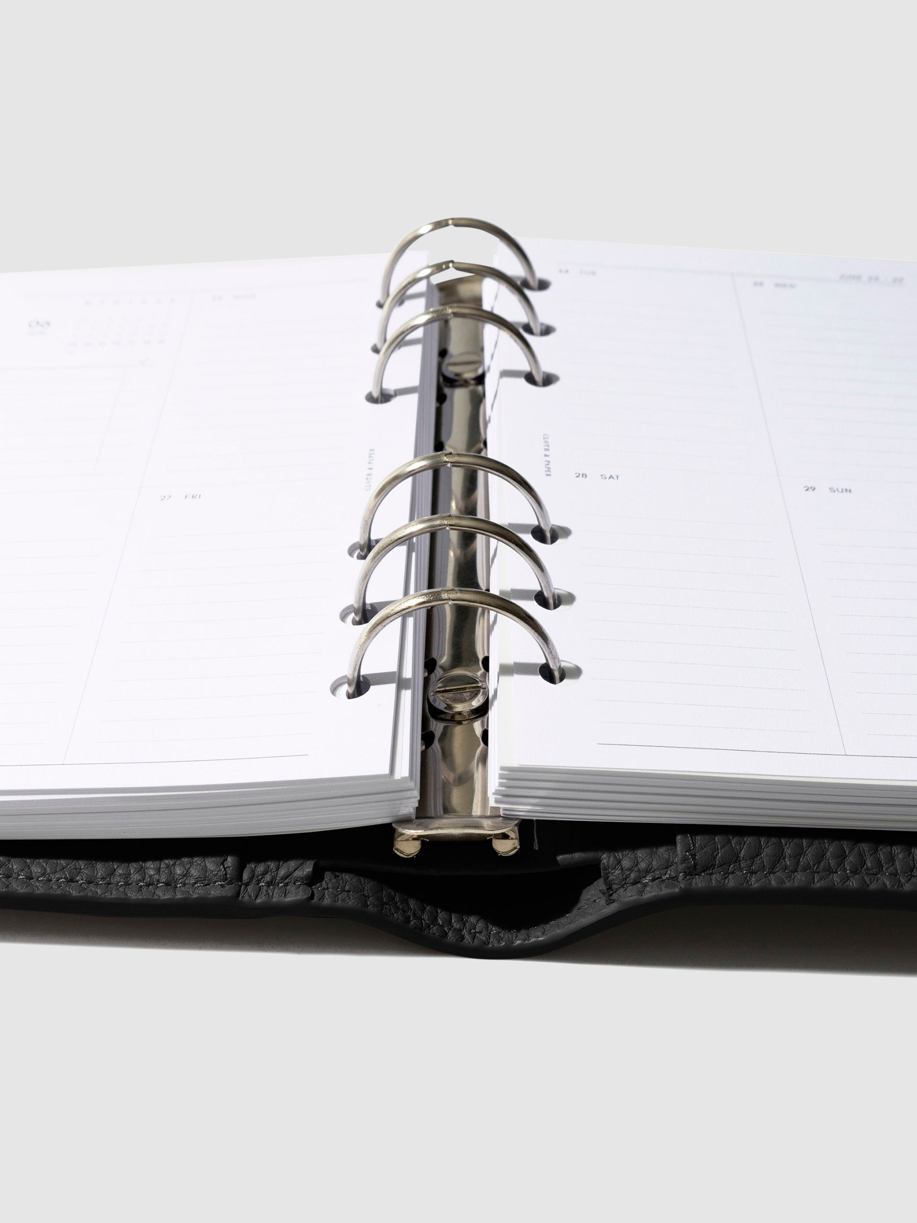 Close-up of the black leather agenda ring mechanism.