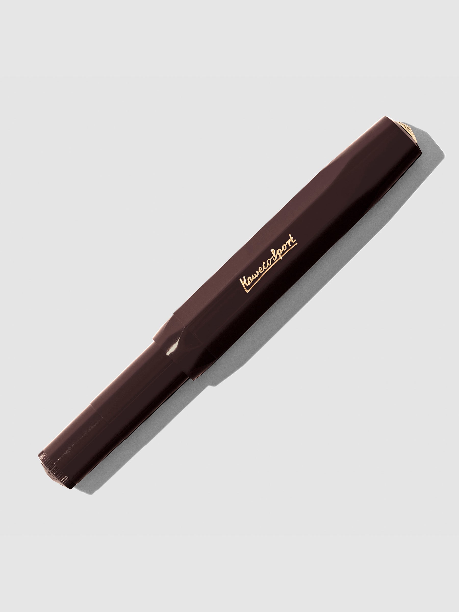 Burgundy Rollerball pen displayed with cap on a neutral background.