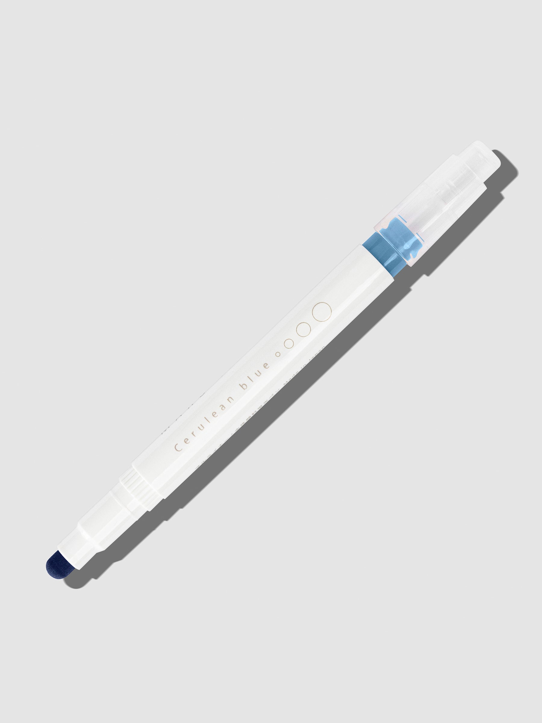 Cerulean Blue highlighter with tip exposed and cap posted to the end of its barrel on a neutral background.