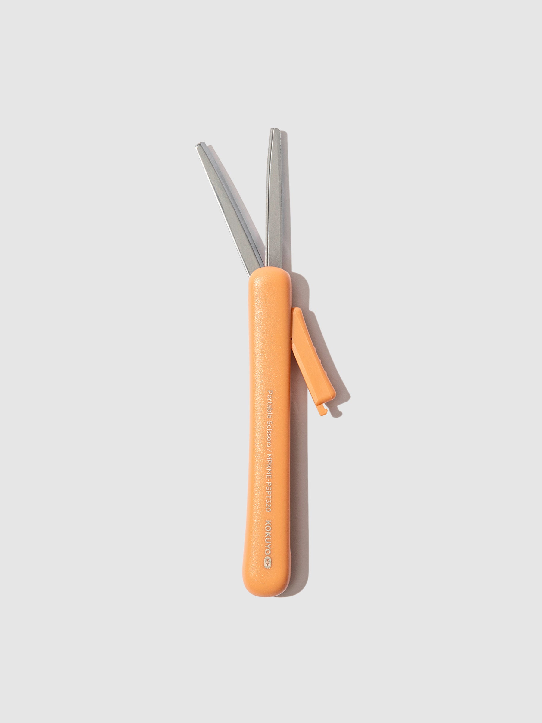 Scissors with blade exposed, displayed on a neutral background. Color shown is Kurumi Brown.