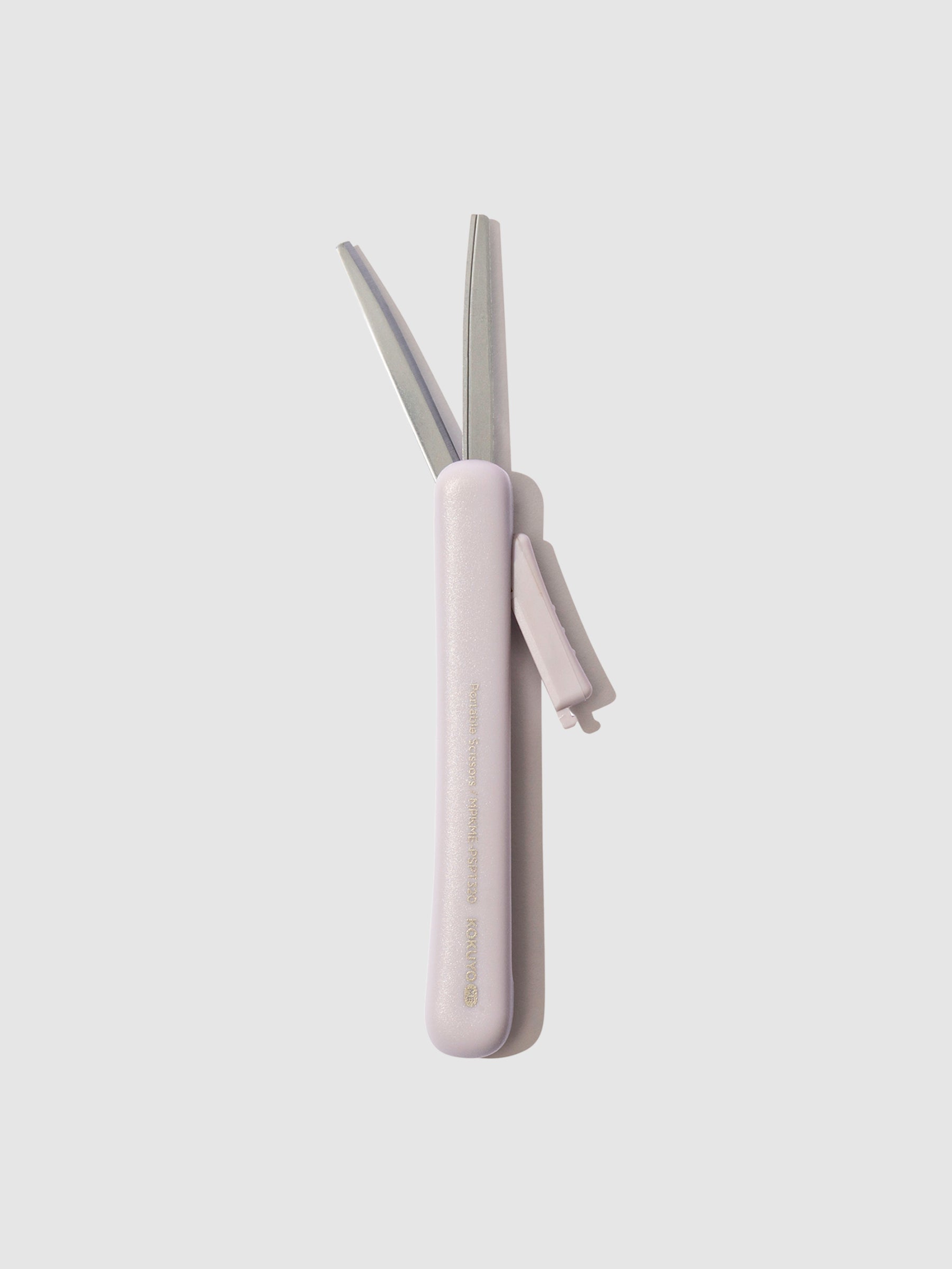 Scissors with blade exposed, displayed on a neutral background. Color shown is Misty Lilac.