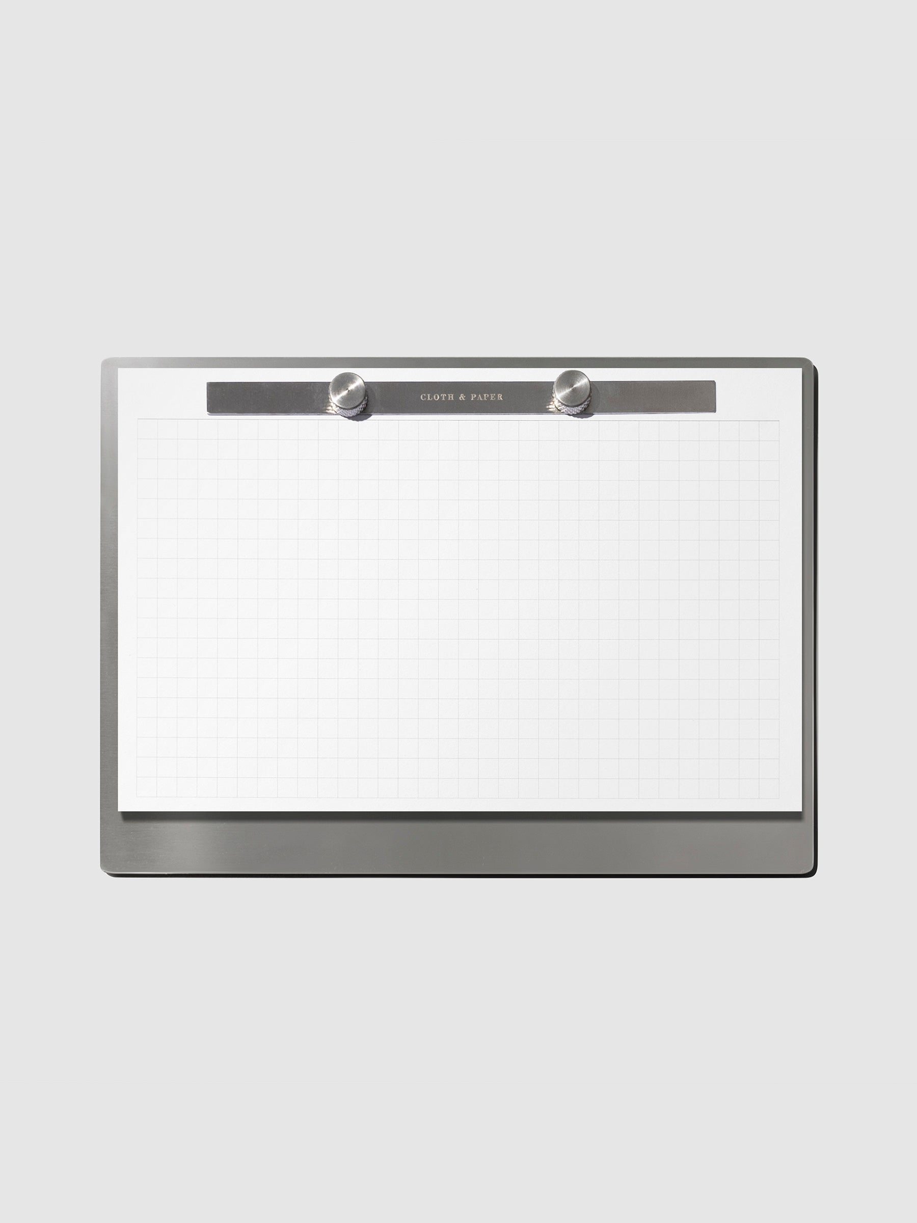 Modern Bound Notepad Insert Refills, graph, filled on the Modern Bound Notepad board, resting on a light gray background