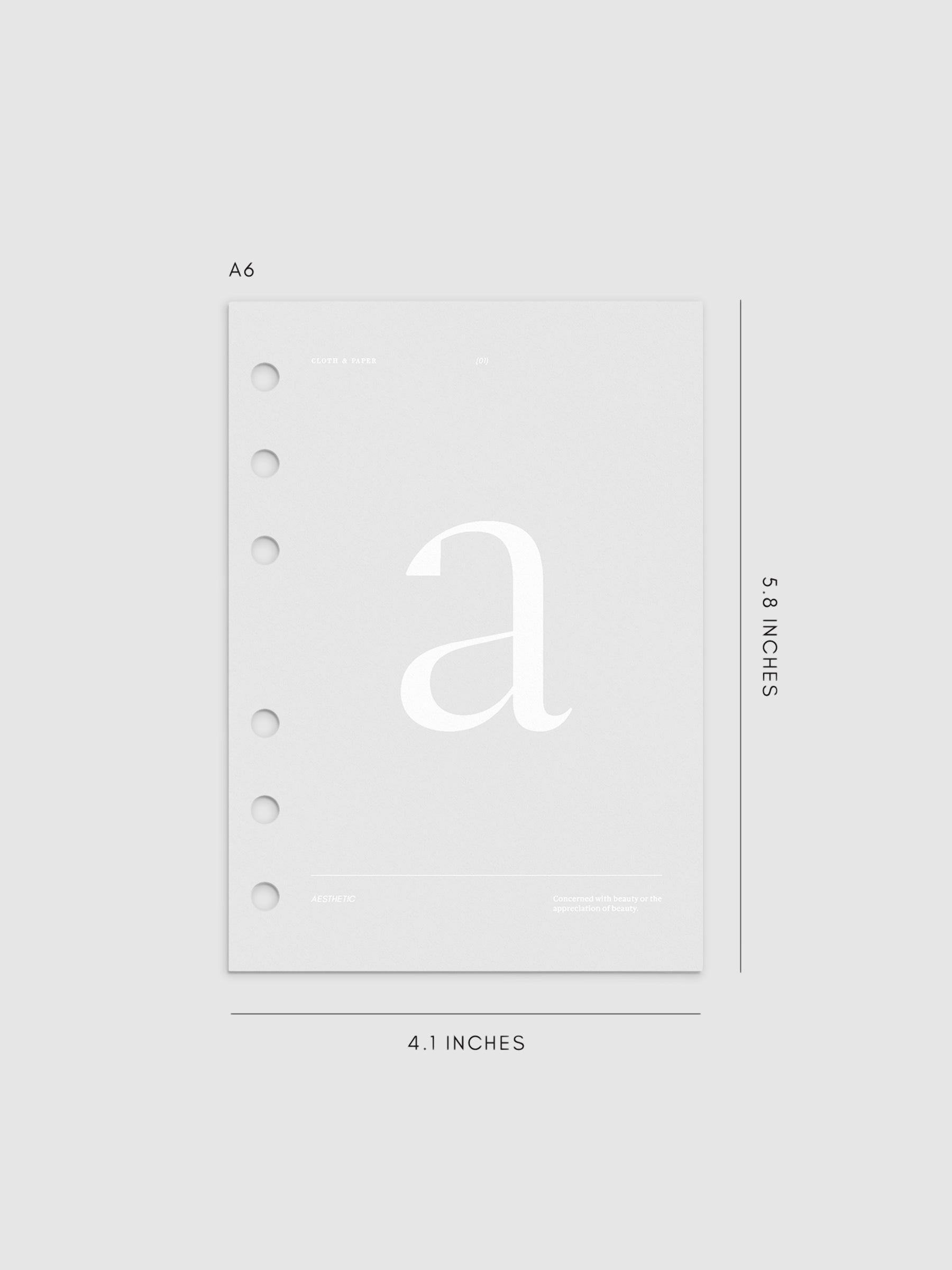 Monogram Vellum Planner Dashboard A in A6 displayed on a neutral background.