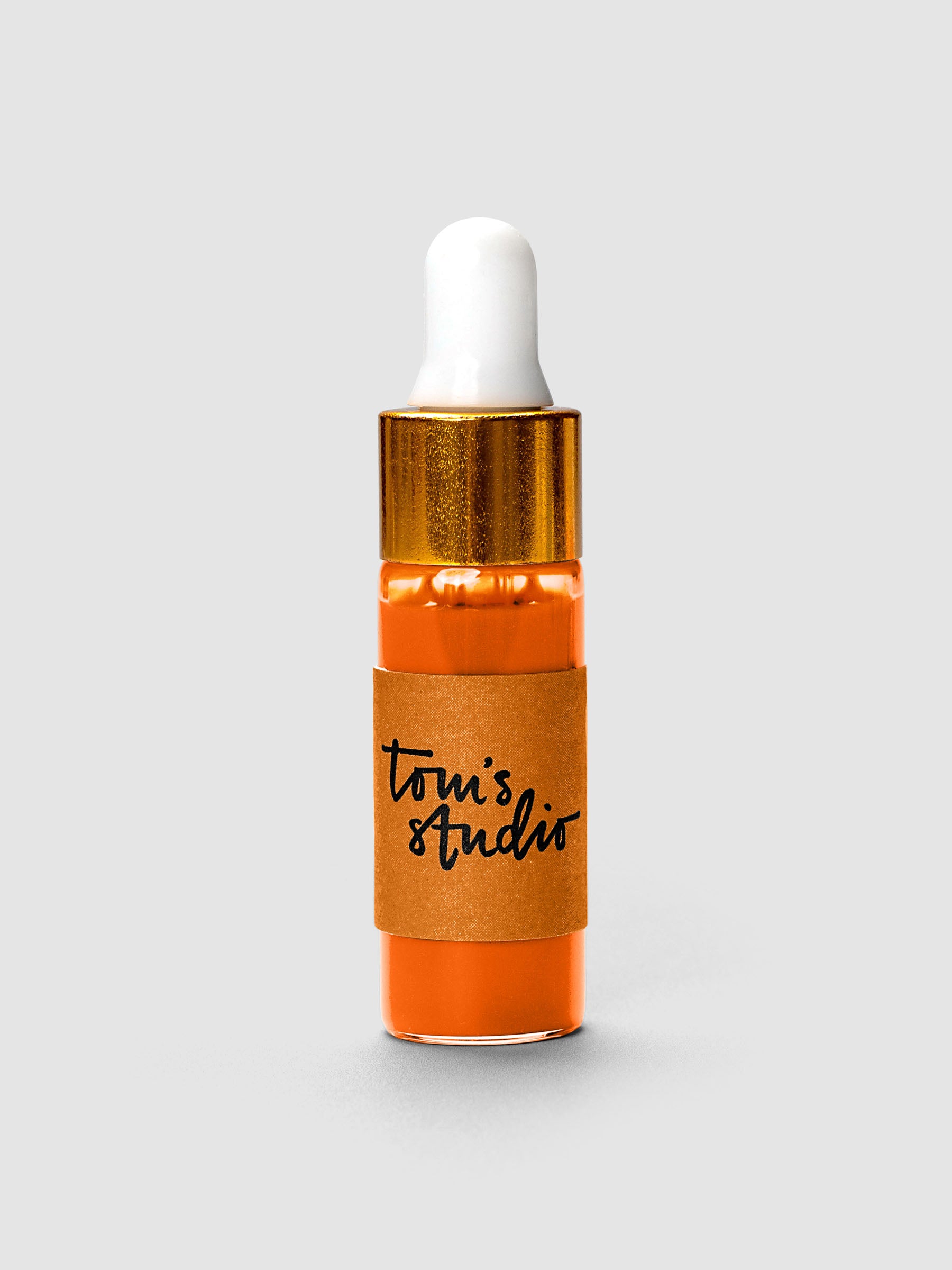 Tom's Studio Mini Highlighter Ink bottle with gold cap and white dropper in orange