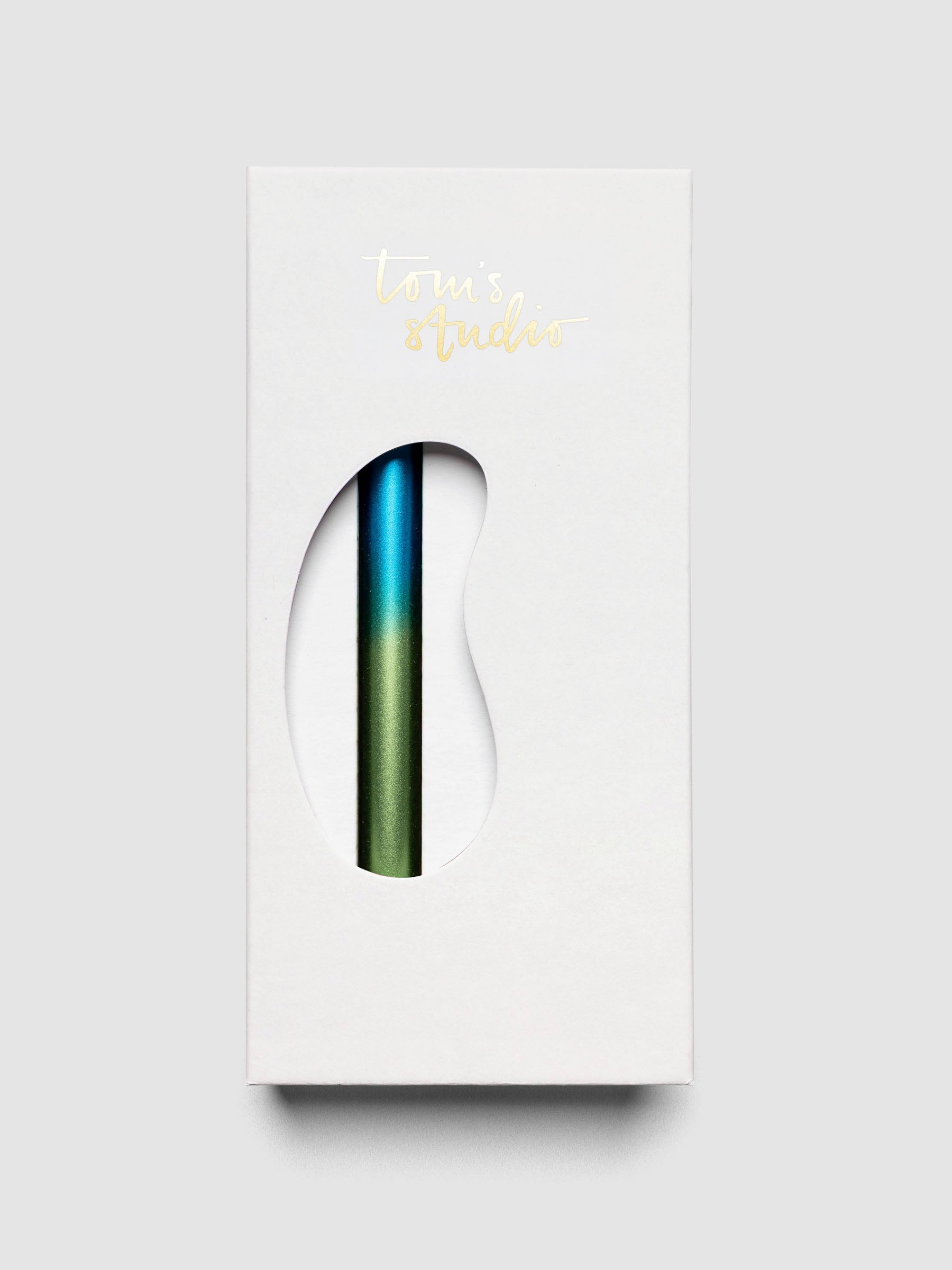 Tom's Studio Ori Refillable Highlighter in white packaging box with blue and green ombre pen visible through cutout window