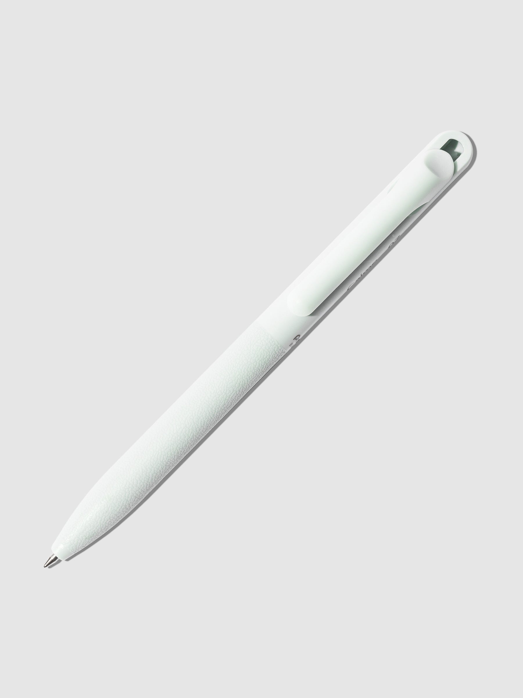 Pentel Calme Ballpoint Pen, 0.7 mm, Sky Jade, Cloth and Paper. Pen displayed with nib exposed on a neutral background.