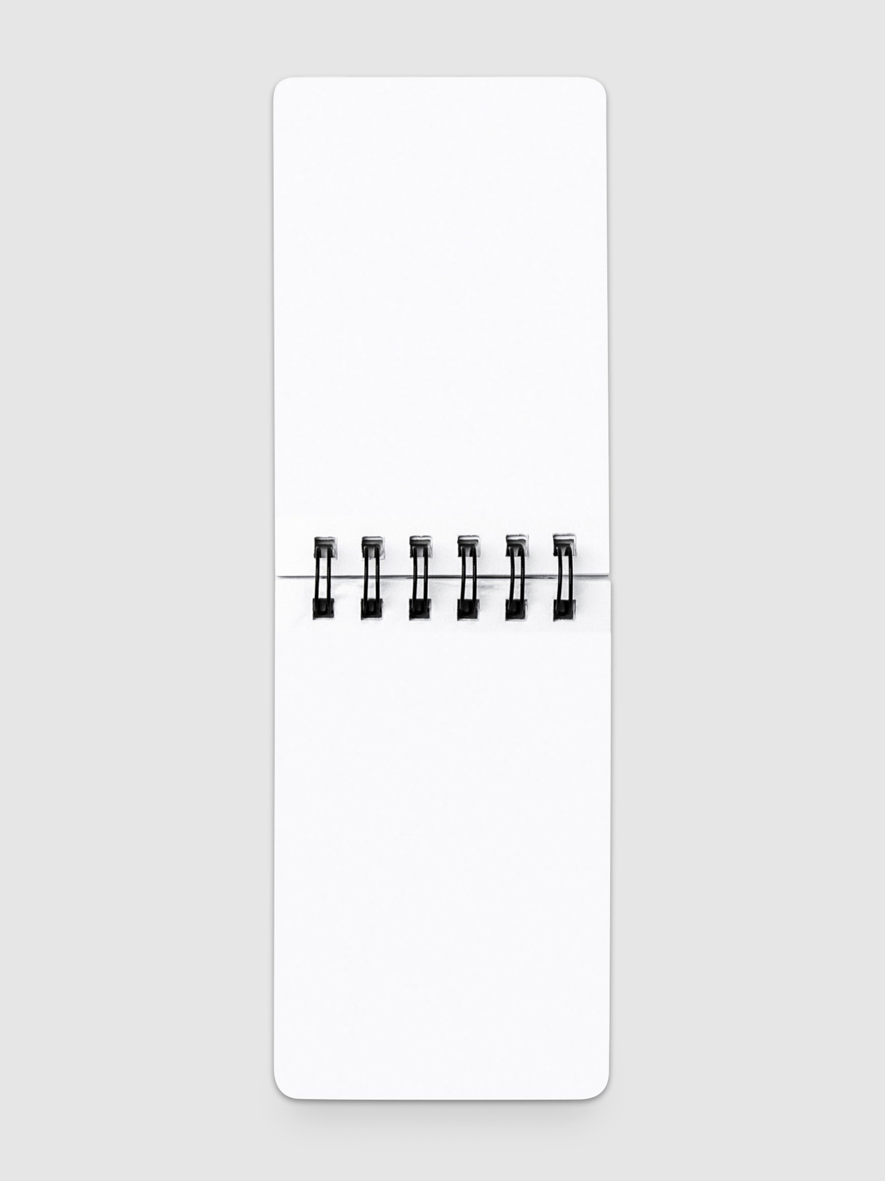 Blank notepad open on a neutral background.