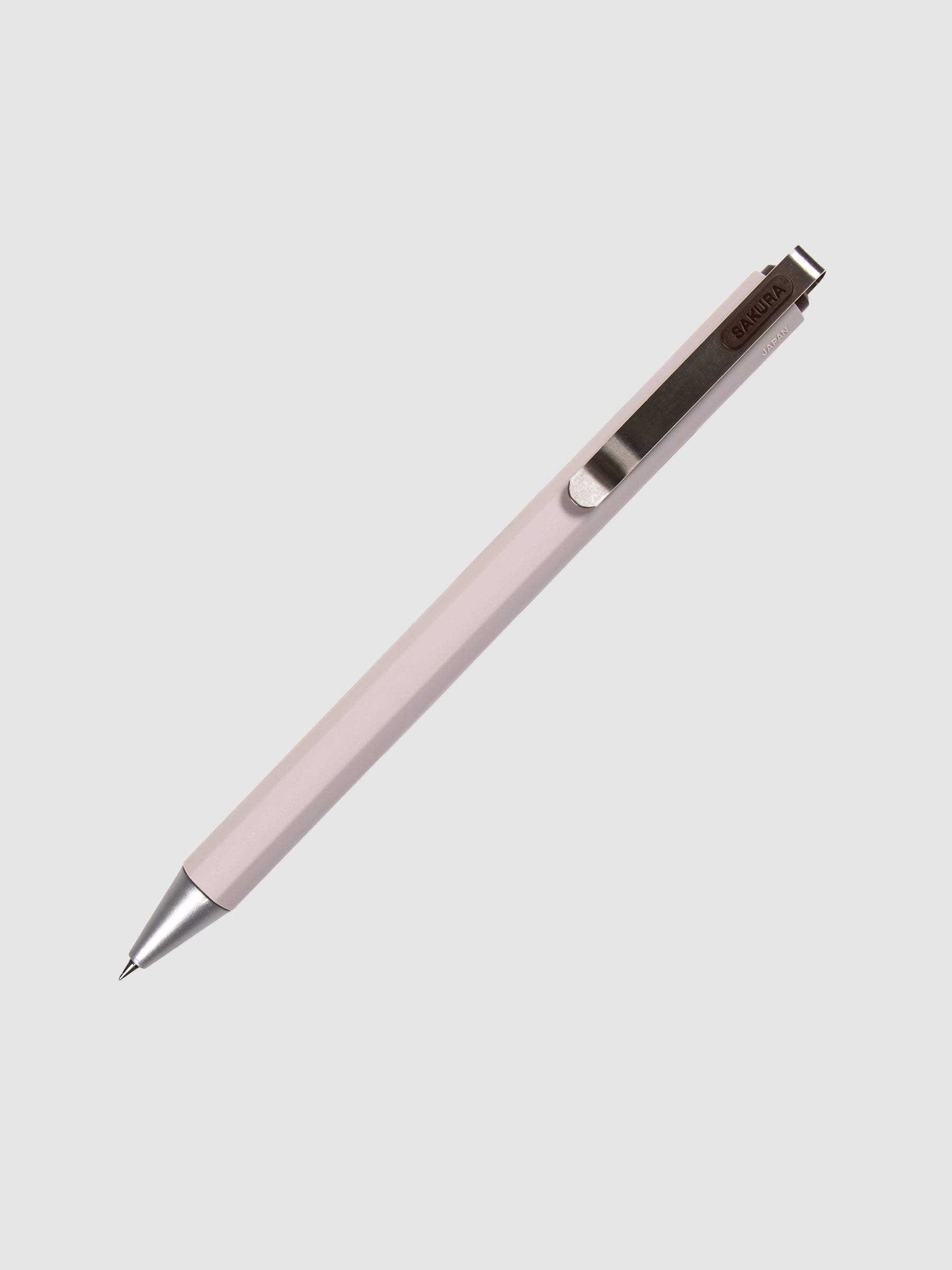 Sakura Ballsign iD Gel Pen, 0.4 mm, Cloth and Paper. Brown black pen turned to the right against a neutral background.