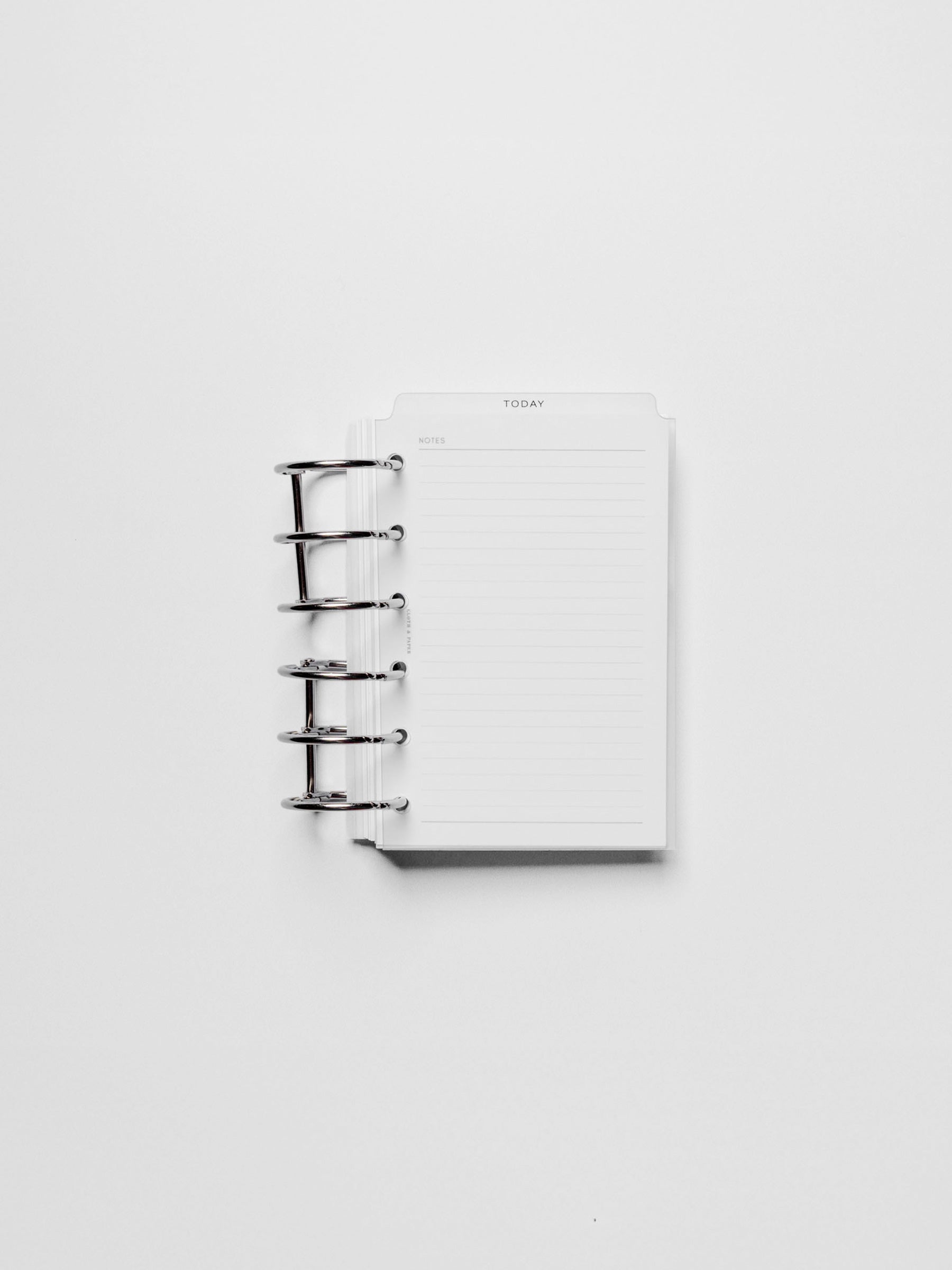 Black foil divider displayed in a metal ring.
