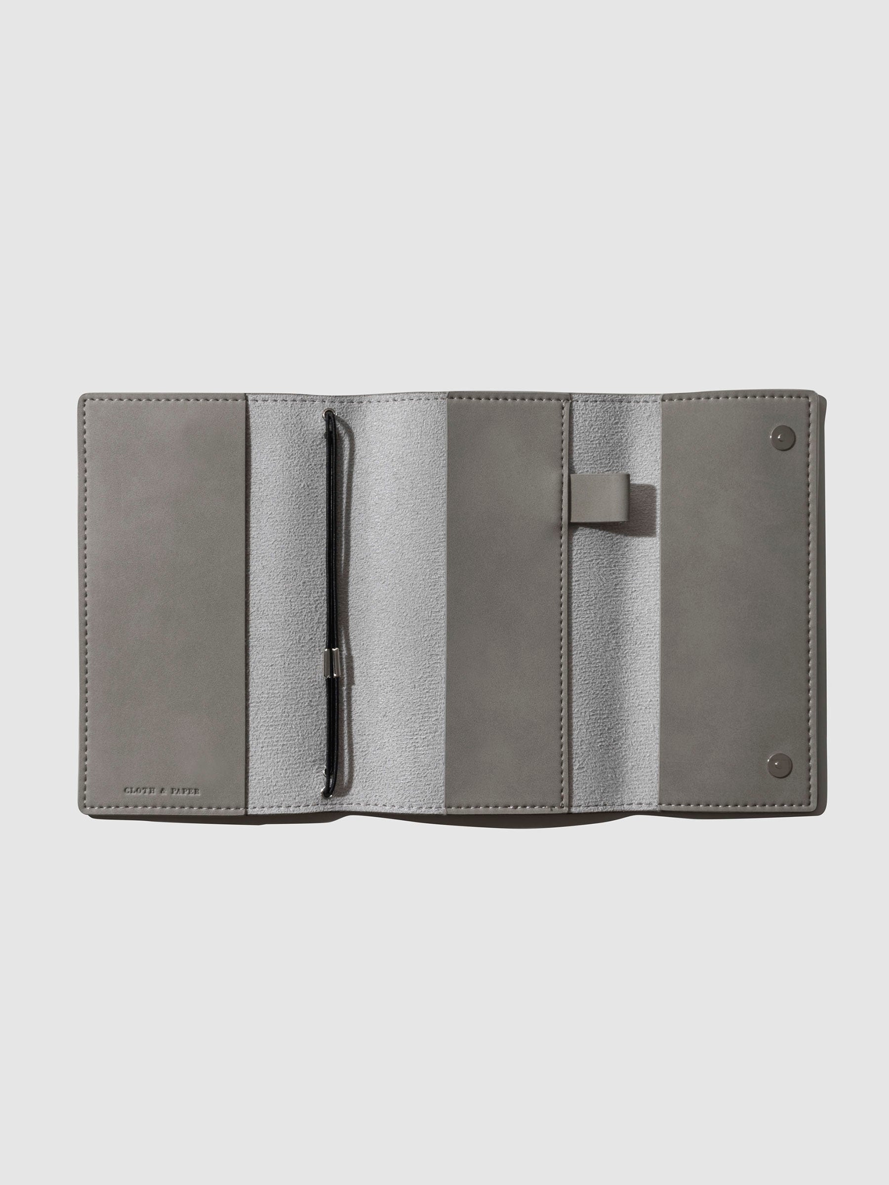 Cover displayed open and empty on a neutral background.