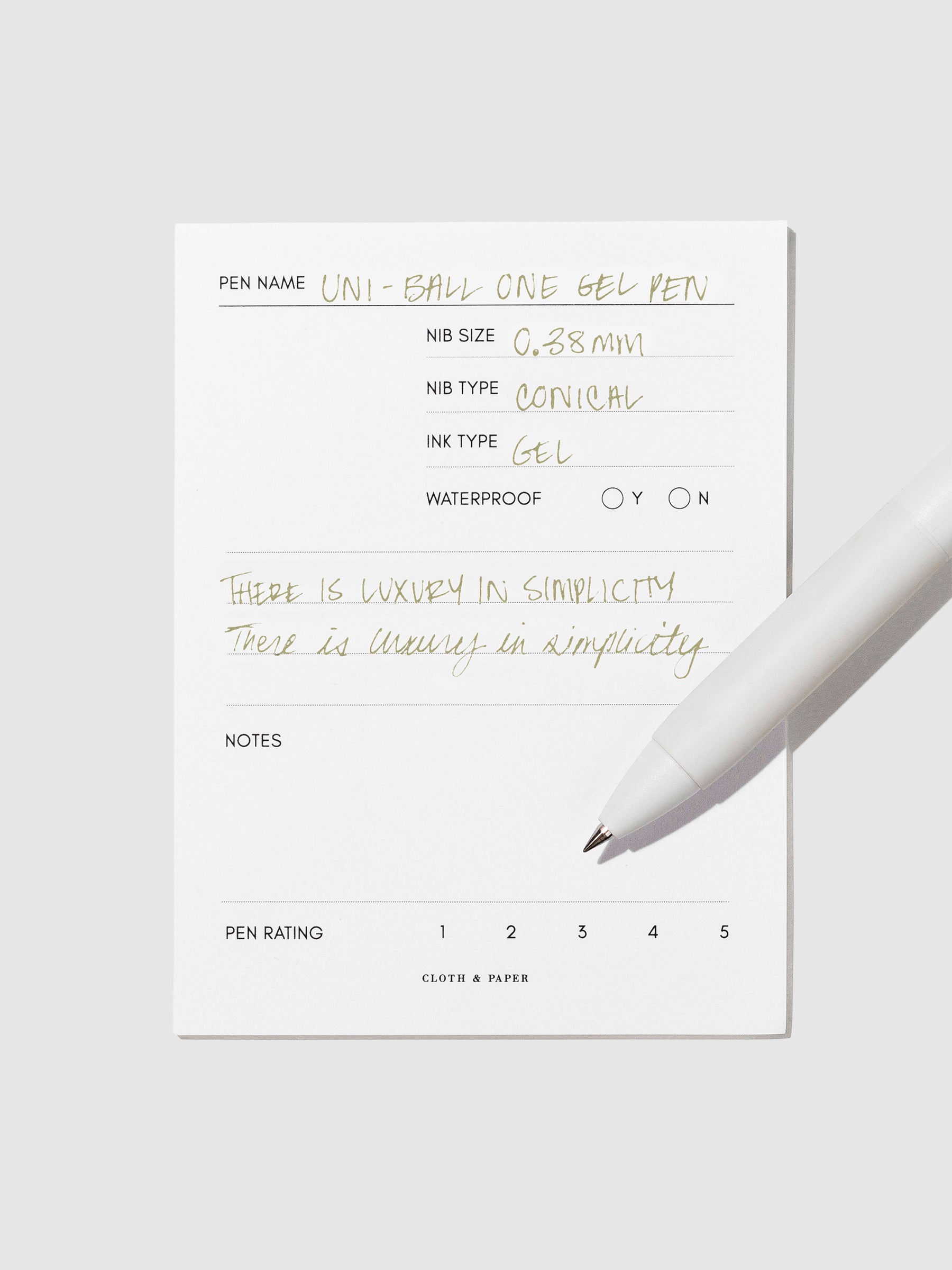Pen tilted slightly to the right on a neutral background. Color pictured is Avocado Green.