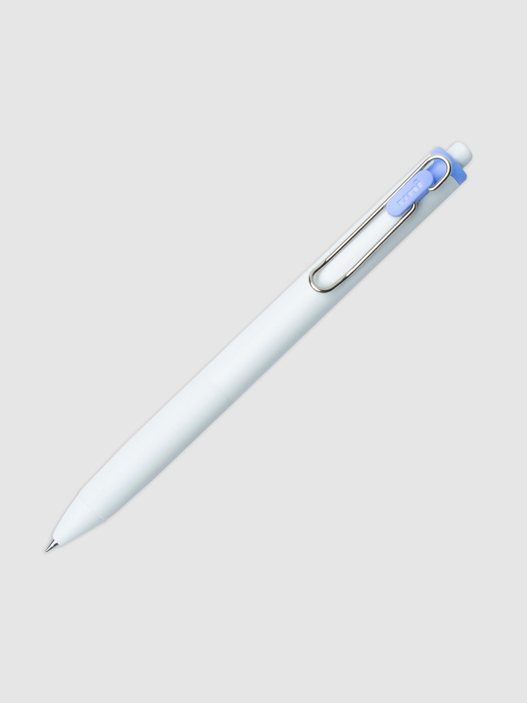Uni-ball One Gel Pen, Blue Colon, Cloth and Paper. Pen tilted slightly to the right on a neutral background.