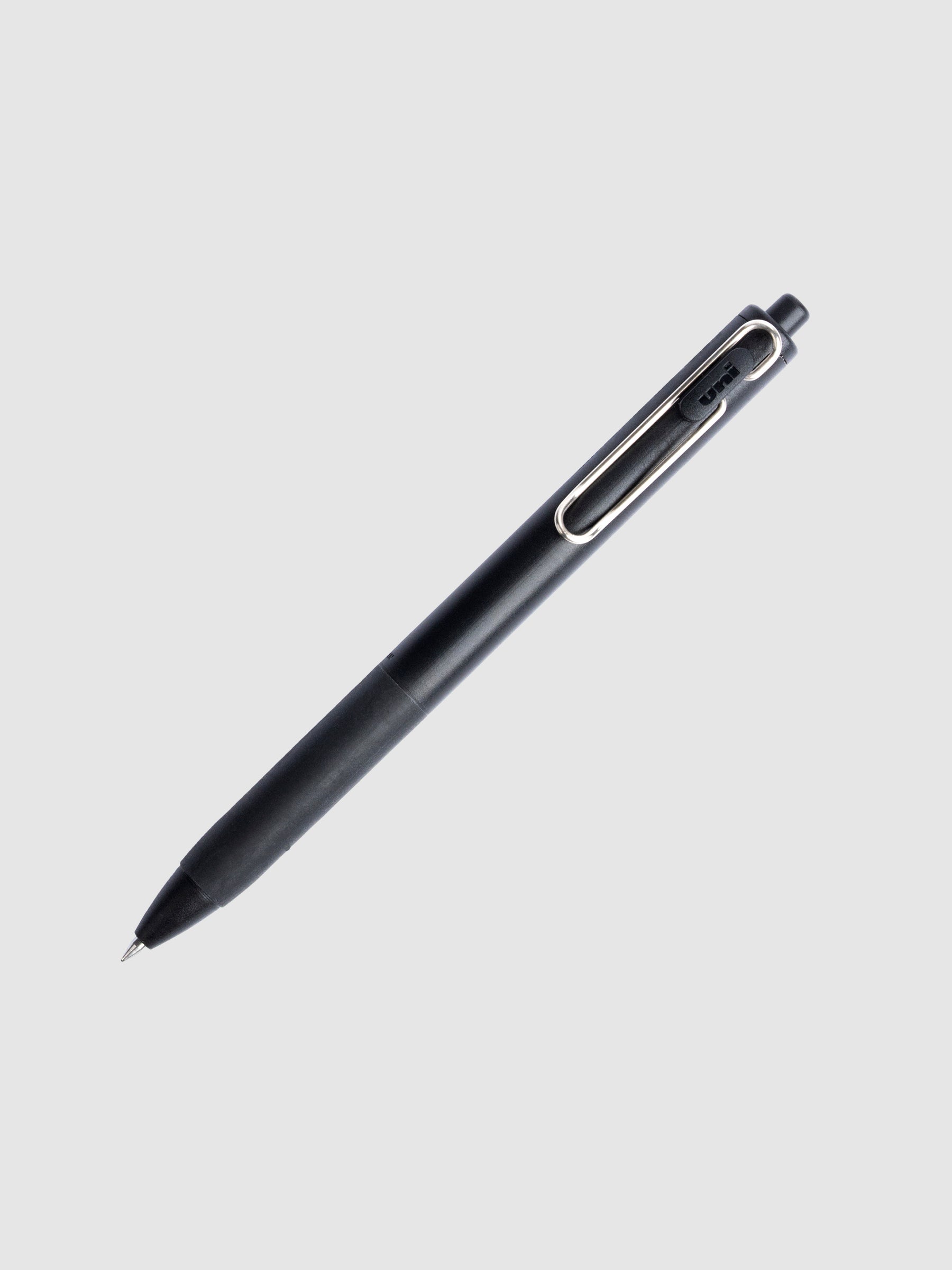 Uni-Ball One Gel Pen, 0.5 mm, black, Cloth and Paper. Gel pen tilted slightly to the right on a neutral background.