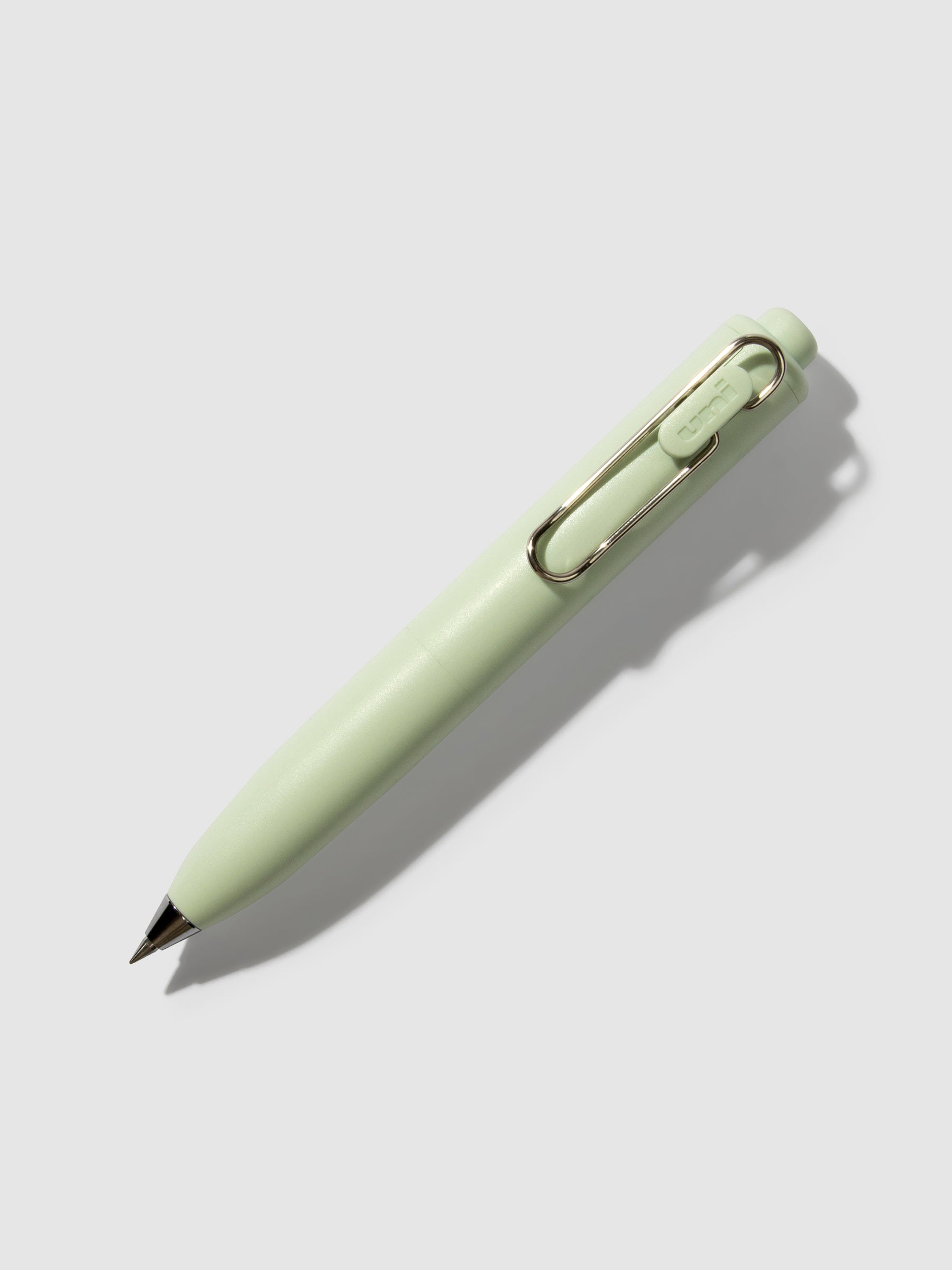Uni-Ball One P Gel Pen, Cloth and Paper. Pen turned to the right on a neutral background. Color pictured is Mint.